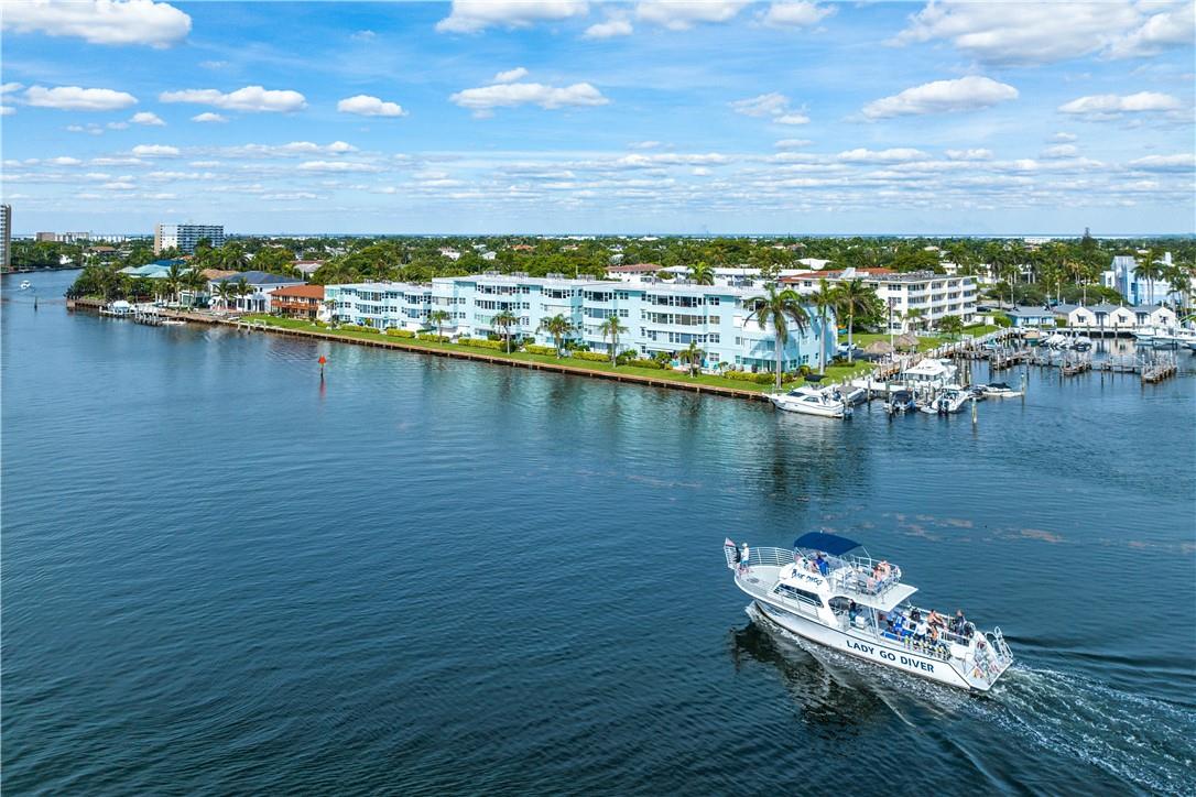 Beautiful 3nd floor unit with direct intracoastal views from this totally remodeled 2 bedroom/2 bathroom corner unit condo with a wall of windows allowing lots of natural light! Nestled in the marina area of Lighthouse Point and home to awesome views of the inlet, Hillsboro Lighthouse and daily intracoastal boat parade, this condo is a winner! Unit 4C features a beautifully renovated kitchen with custom cabinets, granite countertops & stainless steel appliances, engineered hardwood floors, both bathrooms are updated as well as all the windows are impact rated. Being sold fully furnished, ready to move in and enjoy!  Assessment will be paid by seller.  Enjoy coastal living in this all ages community that has a pool w/ community room, Tiki hut for grillin & chillin! Pick up trucks allowed!