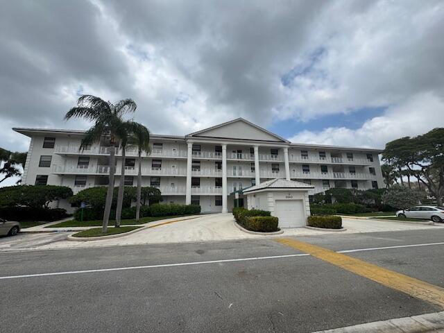 Enjoy South Florida Living from this fabulous 2nd floor LAKE FRONT condo! This tastefully renovated 2 bedroom, 2 bath unit boasts bonus laundry room - perfect for office/den, kid's playroom or storage, spacious living areas with beautiful tile flooring and wood floors in both bedrooms (no carpet!). Extensive living room overlooks stunning wide lake views - all impact windows throughout. Huge master suite offers large walk-in closet and redone bathroom with shower. Split floor plan allows guests privacy with their own bedroom and bath. This incredible condo is conveniently located minutes to Whole Foods and PB Oulets, main highways, downtown West Palm Beach and fine dining. Rent includes basic cable and water and security gate!