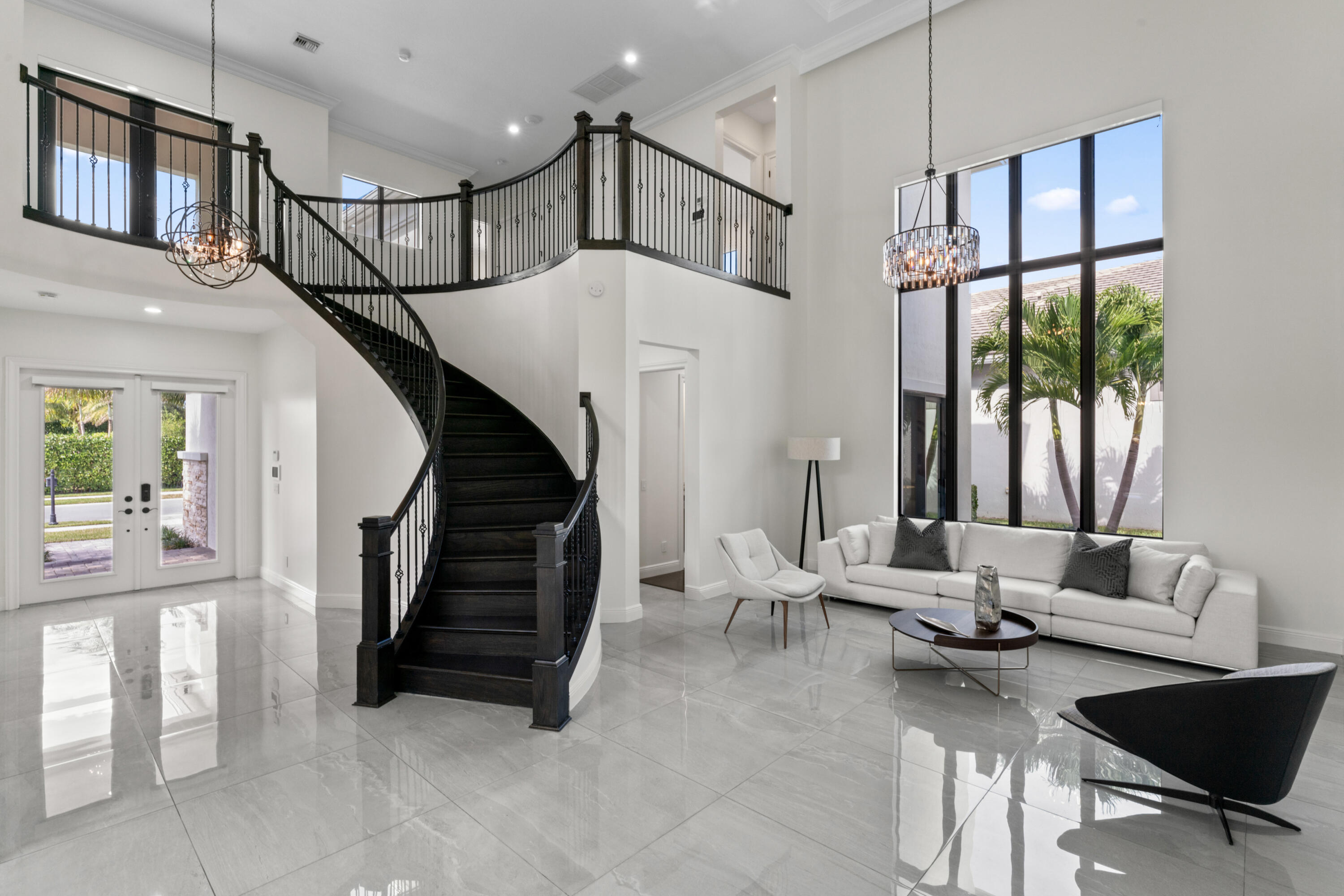 Exceptionally upgraded Callahan model in prestigious Royal Palm Polo, perfectly positioned on a private lot. Spanning 4600 SQ FT under air, this 5-bed, 5.1-bath residence showcases designer finishes and over $800,000 in curated upgrades throughout. The chef's kitchen features Wolf and Sub-Zero appliances, custom cabinetry, and an oversized island ideal for entertaining. Interiors are elevated with Italian porcelain flooring, fully renovated designer bathrooms, custom closets, electric blinds, and all-new lighting. A full-house generator provides added peace of mind. Step outside to a resort-style backyard with a remodeled pool and summer kitchen, designed for year-round South Florida living. Located in a guard-gated esteemed community with premier amenities, and minutes to everything.