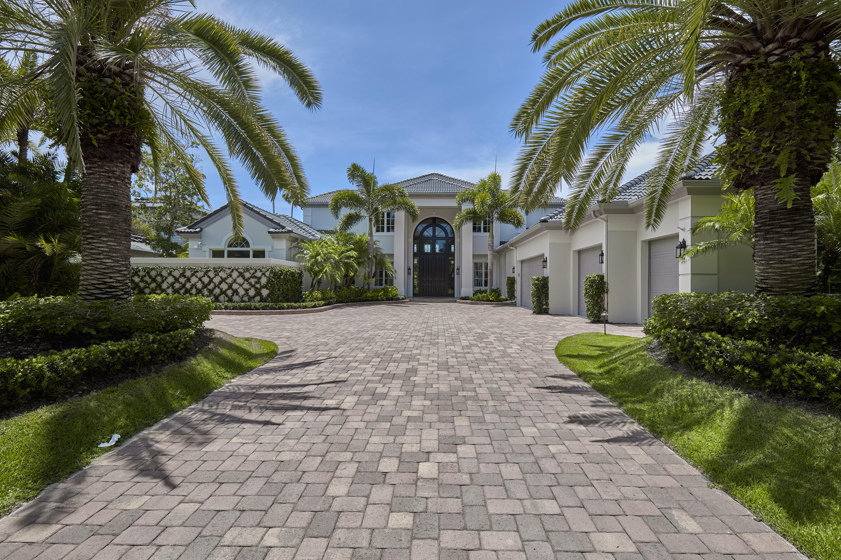 Completely renovated in 2015-16 Designer Transitional 5 bedroom, 5 1/2 bath home with separate guesthouse building.Grand foyer entrance with mahogany doors and Venetian plaster walls throughout into living room. Dramatic curving staircase with new hand wrought iron railings. New 8'' wide board solid walnut floors throughout. State of the art electronics with full Led ceiling lighting. Hi-Tec white Designer kitchen with wolf appliances, and butler pantry. High end counter tops throughout into separate bar. Spectacular new master bath with artisan custom tile work. New Impact resistant doors and windows. Downstairs VIP second master suite with private terrace. Silk draperies, custom designed chandeliers and fixtures. New pebble-tec finished pool. Many more elegant extras. Stunning Onyx wet bar with ice make and wine refrigerator. All new kitchen opens to family room with breakfast area. Custom cabinetry, marble and glass backsplash. Farmers stainless steel sink, top of the line imported stone countertops, twin dishwashers and Wolf appliances. Oversized island with bar seating and extra sink. Butlers pantry with built in coffee maker and wine refrigerator. Master bedroom suite has French doors to private terrace and pool area. Luxurious closet room with wood cabinetry, shelving and drawers. Marble bathroom with his and her water closets and vanities, soaking tub with marble surround, huge shower, dressing room with built in desk, refrigerator and coffee maker. Upstairs features 2 bedrooms, sitting room and 2 bathrooms with rain showers and porcelain flooring. Detached 1 bedroom, 1 bath guest house with kitchenette overlooks glorious wide water views. New swimming pool on marble deck with spa and cascading waterfall. Covered patio with summer kitchen, built in grill and designer fans. Fully fenced yard, new sun deck and dock for 90' boat. Channel Depth - 6ft+, Width 60'. Surrounded by updated landscaping and breathtaking water views.