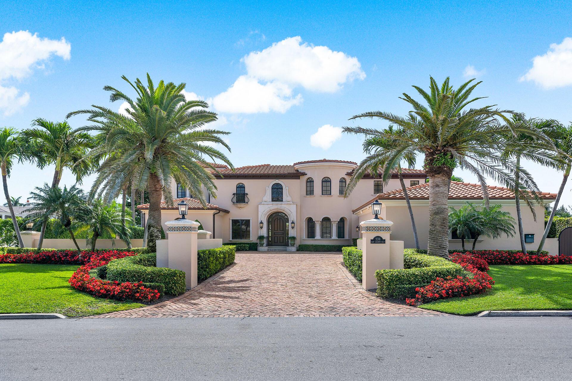 Welcome to luxury living in the prestigious Royal Palm Yacht & Country Club. This trophy property on East Coconut Palm Road is nestled along 111' of the picturesque Buccaneer Palm Waterway. The waterfront estate features 5-bedrooms + office, 5 full and 2 half bathrooms, and a 4-car garage. As you approach the meticulously landscaped grounds, a grand walled entrance sets the tone for what lies within. Marvelous hand-carved finishes, designer wall coverings, and incredible architectural details lead you to over 7,500 sq ft of living and entertaining spaces. The gourmet kitchen is a chef's dream, featuring a large island, premium appliances, and exquisite finishes. Adorned with an entertainer's bar, rich wood built-ins, and a cozy fireplace, this club room is perfect for hosting gatherings or enjoying quiet evenings with friends and family. 

For those who appreciate the finer things in life, the master suite is a sanctuary of luxury. Located on the second floor, it boasts a private balcony with breathtaking water views, a separate sitting room for unwinding, and lavish en-suite facilities. In addition to the master suite, the property offers his and her offices with custom built-ins, providing the perfect space for remote work or creative pursuits. 

With its coveted southern exposure, private dock, and unrivaled location, the resort-style backyard is a true oasis designed for relaxation and entertainment. Enjoy the sparkling pool and spa, soak up the sun on the expansive patio, or dine alfresco in the covered outdoor kitchen, complete with a summer kitchen. This waterfront estate offers unparalleled luxury and comfort in one of Boca Raton's most coveted communities.