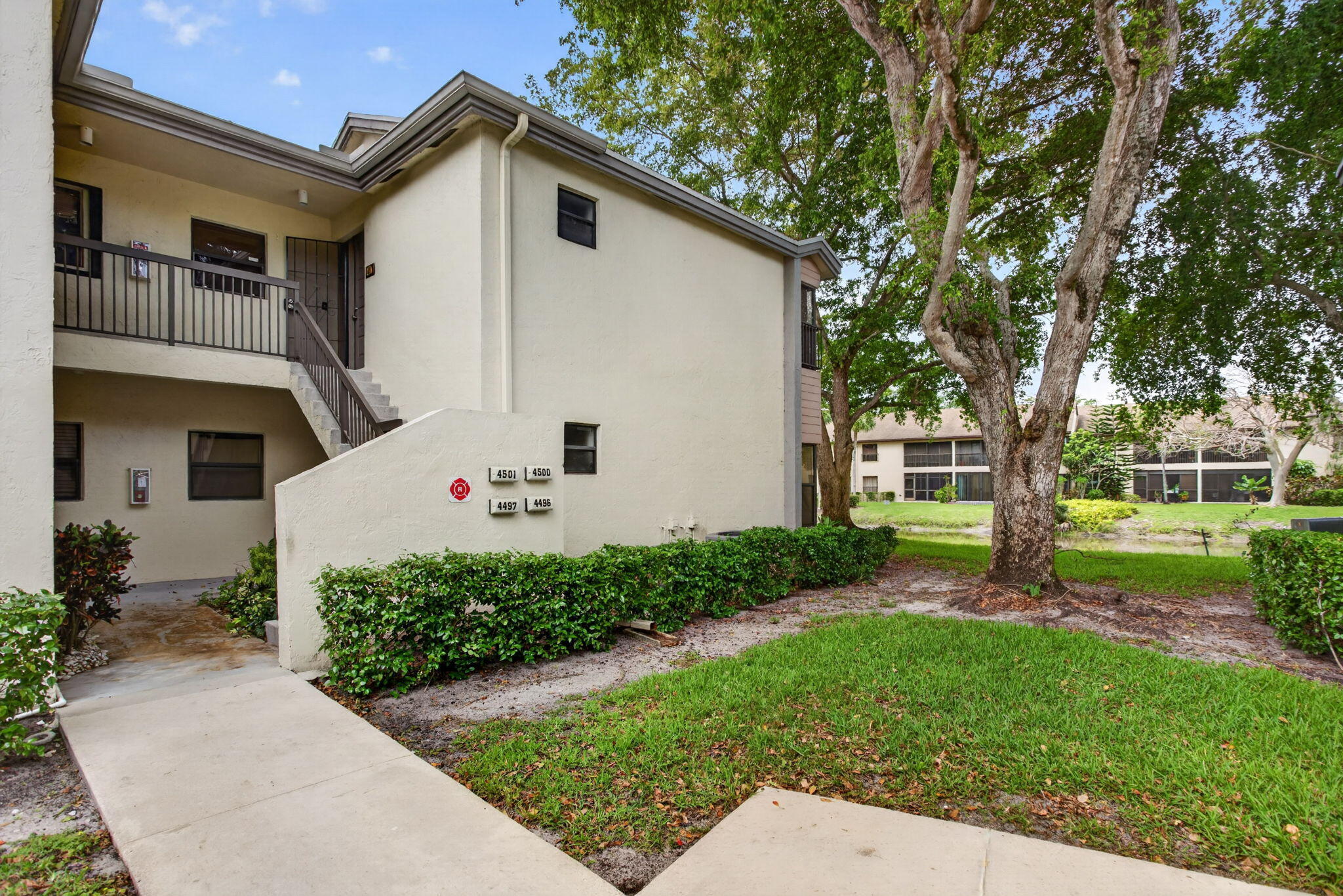 Corner Unit Gem in The Township! This bright and airy 2-bedroom, 2-bathroom corner-unit condo in Baywood Village III offers the perfect blend of comfort and resort-style living. Featuring vaulted ceilings and a split-bedroom layout, the interior feels spacious and private. Kitchen and Bathroom completed renovated. Enjoy serene water views from your living space and take advantage of the modern conveniences including an in-unit washer and dryer.  As part of The Township community, residents enjoy access to premier amenities such as a clubhouse, pool, management on-site, and scenic sidewalks for evening strolls. Located in the heart of Coconut Creek, you are minutes away from top-rated schools like Monarch High and local shopping. This move-in-ready residence is a must-see!