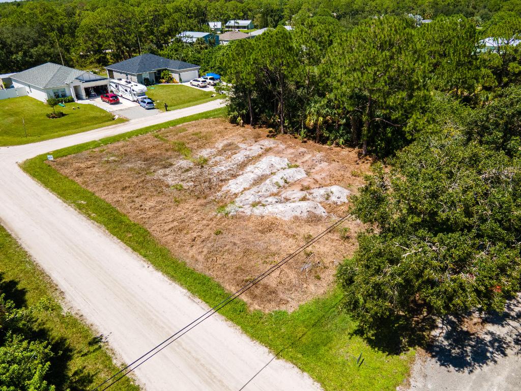 Price Reduced! Great opportunity to build your dream home or investment property on this desirable 0.22-acre corner lot in a growing Vero Beach community. This cleared parcel (approx. 9,583 sq ft; 130' x 75') offers excellent design flexibility with dual-street access, allowing for versatile layouts, convenient driveway placement, added natural light, and strong curb appeal. Corner setting provides enhanced privacy and landscaping potential. Close to local amenities, shopping, dining, and beautiful beaches. Buyers to verify zoning, utilities, subdivision requirements, and all permitting.