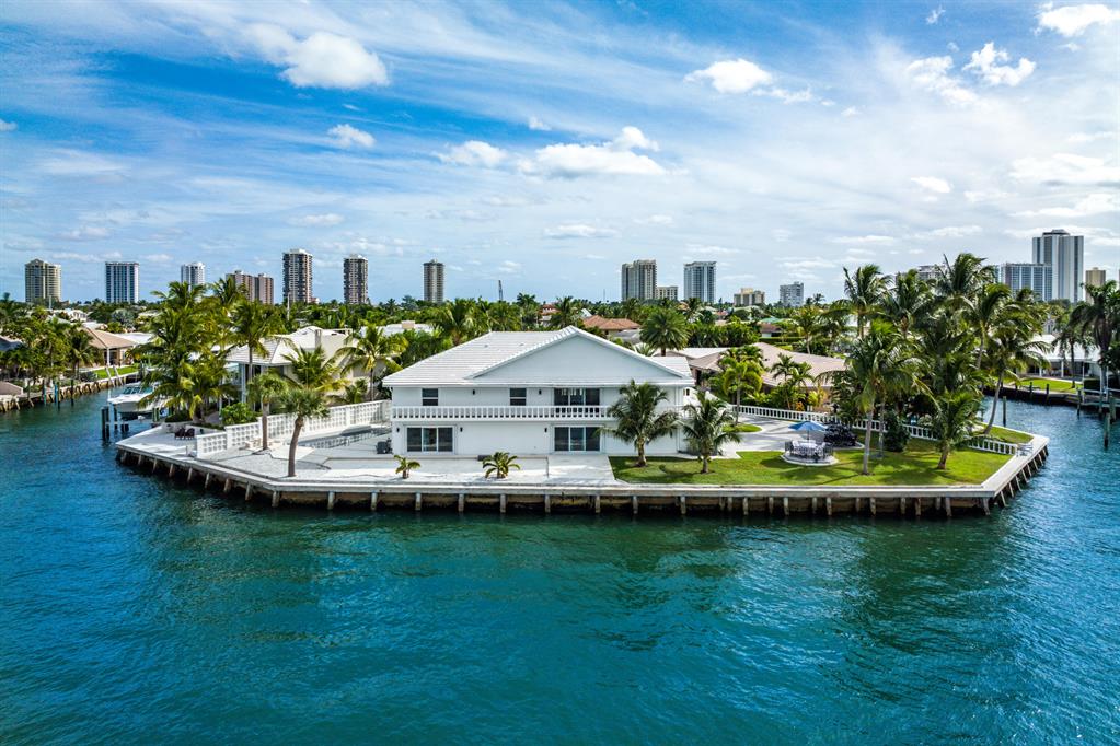 Sunsets and Serenity...
Enjoy 228 + Feet of private and amazing expansive Intracoastal water views! 
6000 + SqFt of Living Space
0.40 Acre Lot 
Just minutes to the ocean via the Palm Beach Inlet with no fixed bridges. 
This custom-built estate, a staple of Singer Islands waterfront homes, offers luxurious Intracoastal, expansive water views.
Upon entering the home, you will be welcomed by a grand custom staircase leading to an open concept upper-level floor plan. There, you will find a custom kitchen, a large family and dining area, three bedrooms, including the primary suite, and a bonus room. On the lower level, you will find a large living room, wet bar, guest bedroom, and bonus room. Perfect for entertaining. Come and experience for yourself.