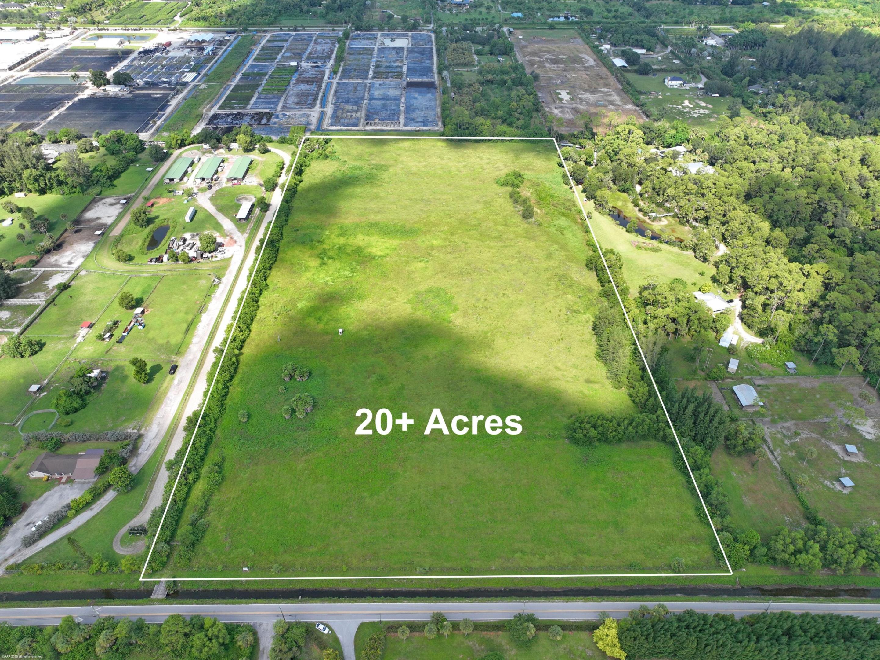 Exceptionally private 20-ACRE property on paved E road with easy access to Okeechobee Rd.  This rare and unique offering is currently composed of two contiguous 10-acre parcels but may be combined into one or further subdivided into four 5 acre parcels. The land is cleared, fully fenced, and ready for a wide range of uses. Equestrian enthusiasts will appreciate the space for a regulation polo field, multiple arenas, barns and numerous equestrian features. Others may envision a nursery, farm, or custom estate with space and privacy. The property is mostly high and dry with elevations about 20ft ASL.  Existing storm water management includes a small pond and some drainage infrastructure that empties into the main canal just to the east. Additionally, electric is already on-site. Fantastic location near modern conveniences, easy access to major roadways but also a very private and quiet country setting just down the road from the Royal Palm Beach Pines Natural reservation with over 700 acres of manicured trails.