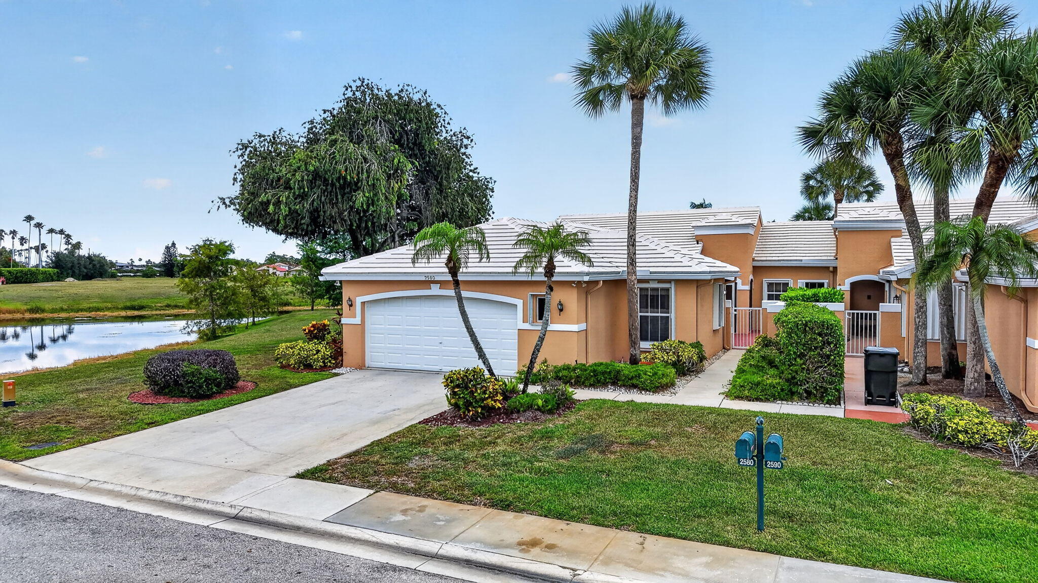 Exceptional opportunity on one of the premier lots in the community! Enjoy breathtaking wide lake views and an expansive side yard that provides added privacy and open space rarely found. This well-maintained home features a screened-in pool, and a spacious outdoor living area perfect for relaxing or entertaining while taking in the water views. A truly special property combining location, views, and outdoor enjoyment.  Community is gated.  The office / den can easily be converted into a third bedroom if needed.