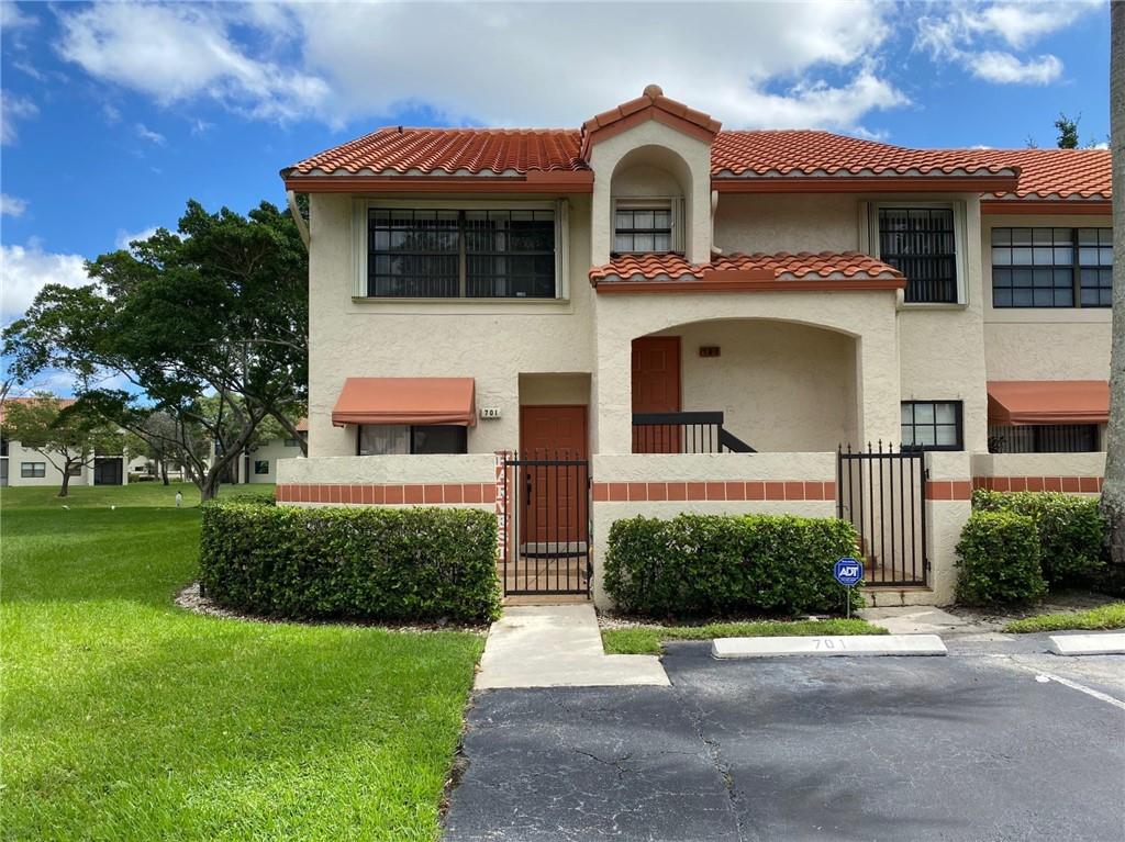 This 2nd floor corner unit condo is the largest model within Independence Bay and features 3 extra windows, a huge screened-in patio with peaceful water views, vaulted ceilings and is tastefully updated throughout.  This large Madison 2 model gives you 2 additional bonus rooms; one is currently being used as a formal dining room and the other one is being used as a home office.  The kitchen has recently been updated with granite countertops and all newer stainless appliances and both bathrooms are completely updated as well.  You have a new full-size washer/dryer, accordion hurricane shutters all around, tile & laminate flooring throughout and the A/C is only 3 years new!  One pet to 25lbs ok.  Independence Bay is centrally located to Florida's Turnpike, the Sawgrass Expressway and I-95.