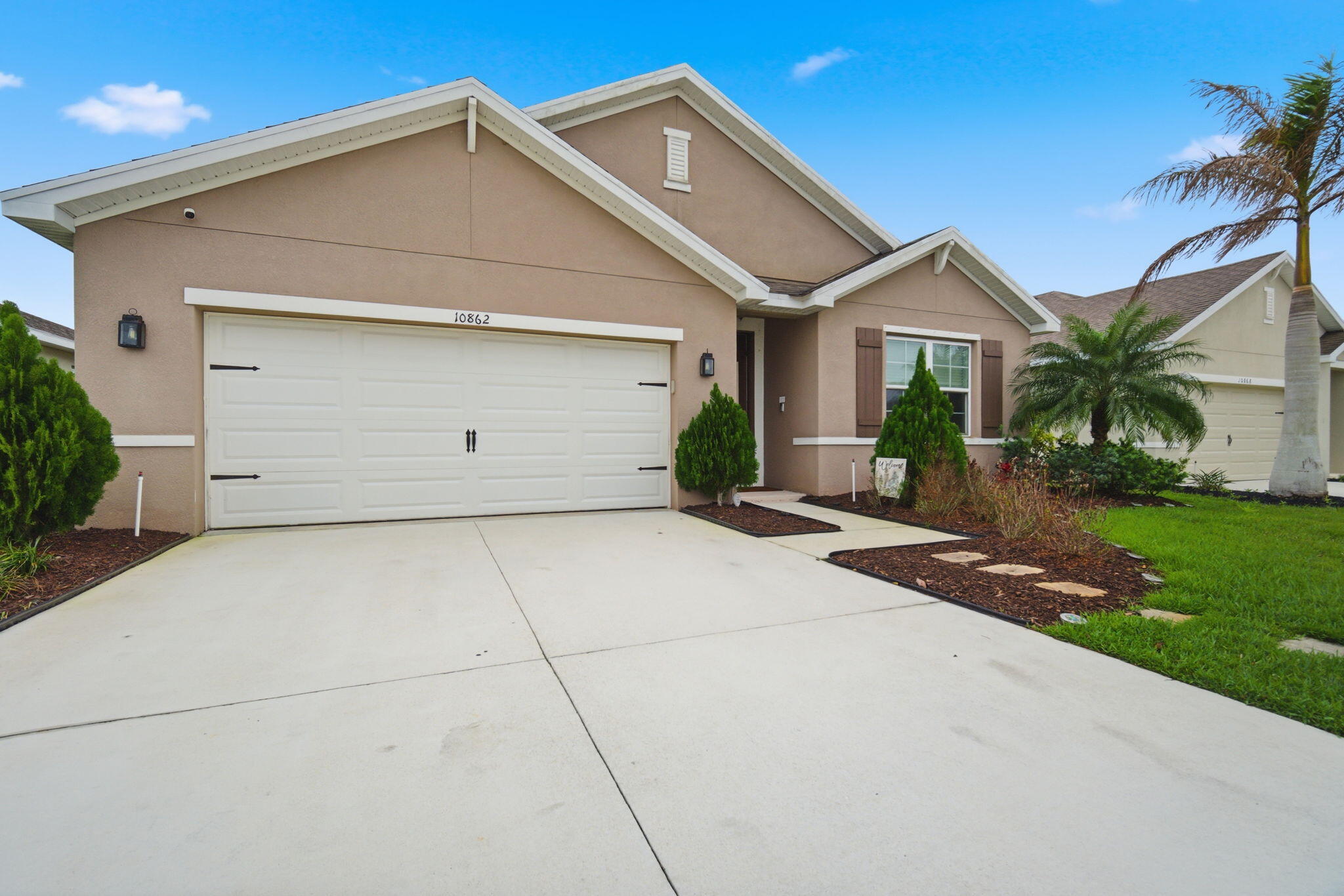 Welcome to this beautifully maintained 4-bedroom, 2-bathroom single-family home located in the highly desirable community of Port St. Lucie. Built in 2020, this modern residence offers the perfect combination of contemporary design, functionality, and move-in-ready convenience.  The open floor plan features spacious living and dining areas, ideal for both everyday living and entertaining. The split-bedroom floor plan provides added privacy, with a generously sized primary suite offering a relaxing retreat, complete with a private en-suite bathroom. Three additional bedrooms provide flexibility for family. Enjoy Florida living at its finest with a covered patio and backyard space. Conveniently located near shopping, dining, schools, and major highways.