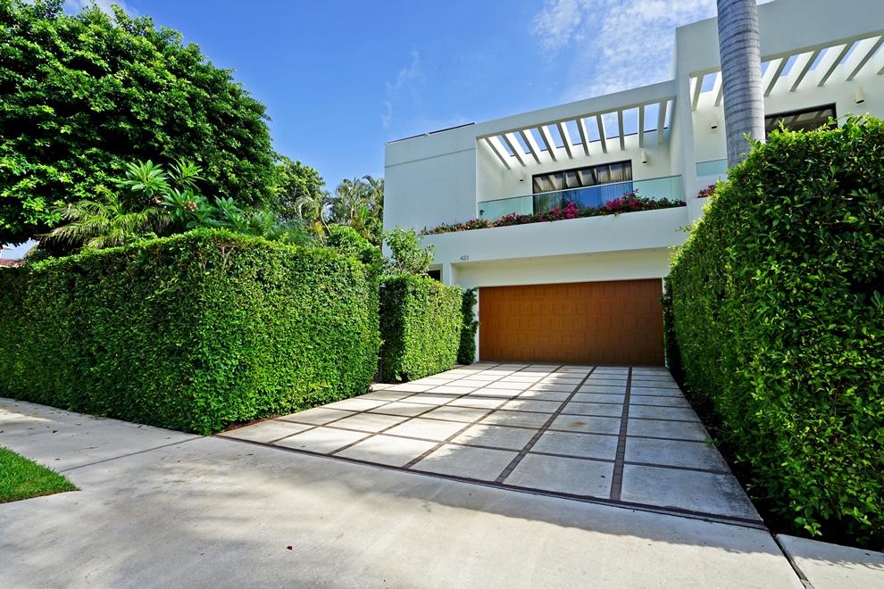 In-town location is central to everything! Contemporary style townhouse with private pool, 2-car garage, library and elevator.