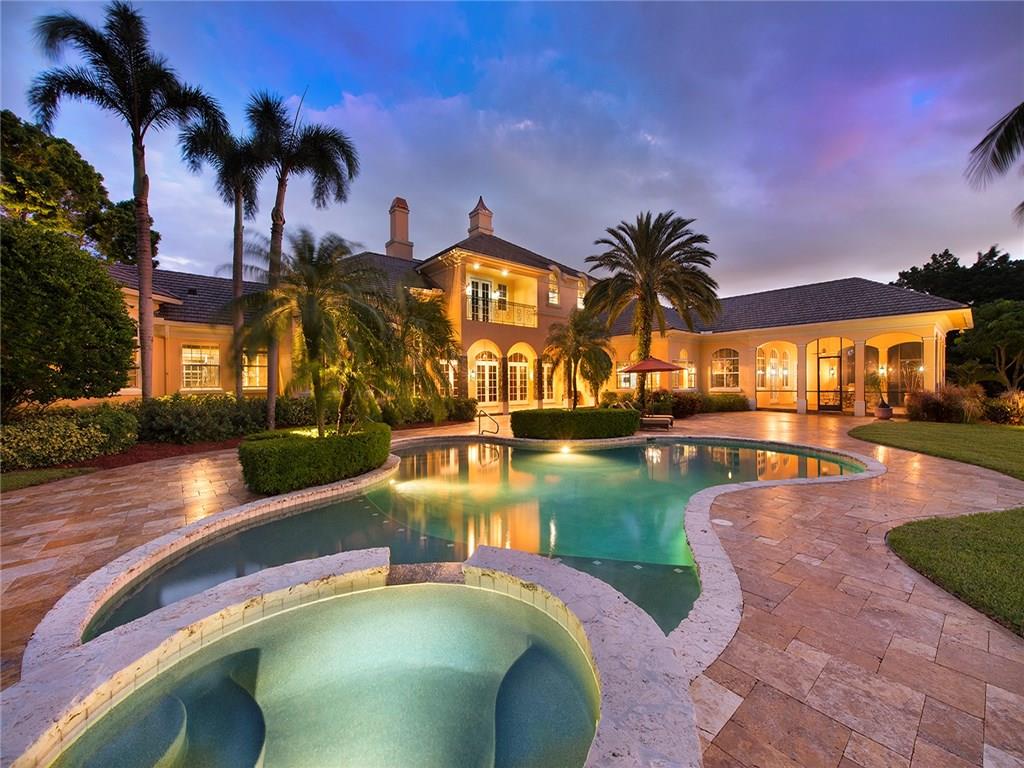 This Property will be sold at LUXURY AUCTION on Dec 16, 2017 with a Reserve of $1,500,000! MLS LIST PRICE FOR REFERENCE ONLY. Ranch-style, lakefront estate within gated enclave. Spectacular sunset views. Two-story, 5 beds, 7.5 baths and a new (2015) gourmet kitchen. Attached guest quarters with full bath, currently used as exec office. Home theater, fitness center, boat dock, 2-stall barn with tack room, and more! Ag exemption for low taxes! CALL OFFICE FOR INFO (Do not call list agent). A Must-See!
