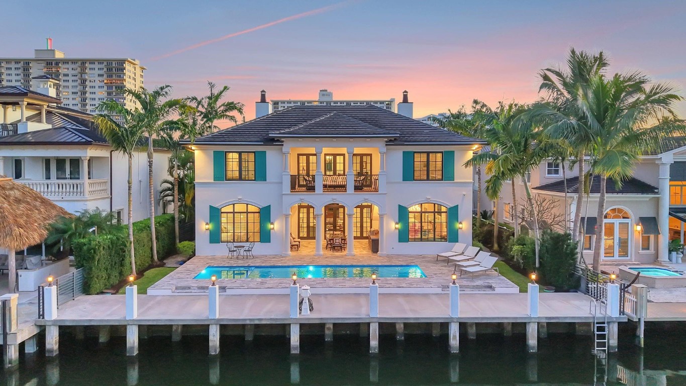 Located in highly desirable guardhouse secured Seven Isles! Elegant, newer British West Indies-inspired 75 ft deepwater residence has much to offer the avid boater & entertainer. Abundant natural light, high ceilings, balanced formal & living areas includes formal living room, lounge, amazing eat-in Chef's Kitchen, marble island & counters, Wolf & Sub-Zero appliances. Ample storage throughout. Superior floorplan includes rare 1st level primary suite, large dual closets & spa bath. Large home office or potential 5th bedroom. 2nd level loft/media area & wet bar opening to large, covered balcony capturing waterfront & pool views. Expansive secondary bedroom suites. Salt-water heated pool & BBQ area. Close to beaches, shopping & dining on Las Olas. Available for quick closing. *Garage is Lift Compatible