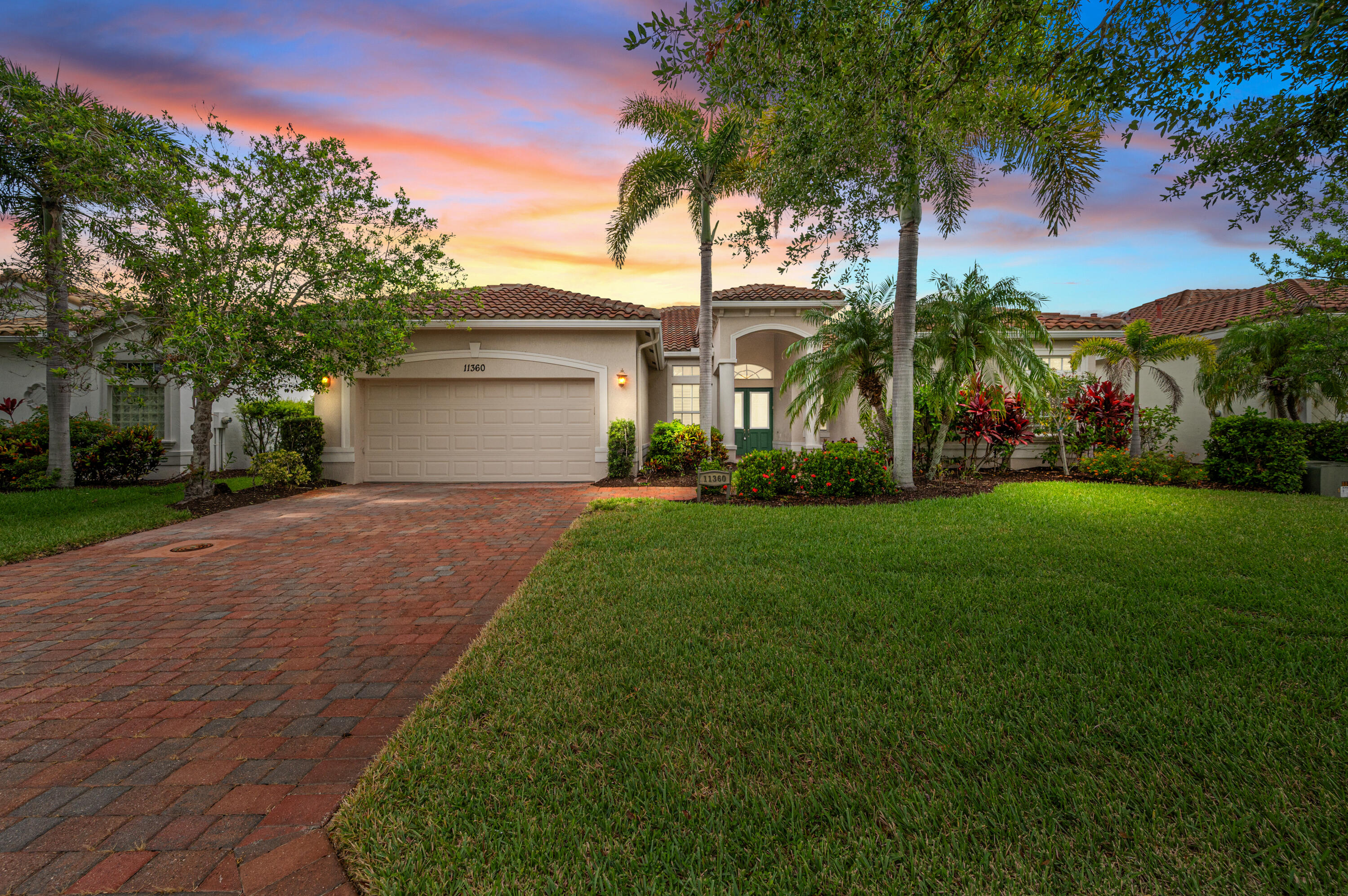 Come see this Beautiful 3 bedroom, 2.5 bath home in the gated 55+ community of Vitalia in Port St. Lucie's Tradition community. Resort style amenities for active seniors and their guests. This CBS home with full impact glass is ready for any storm. Spacious primary suite with large bath and closets, includes a private sitting room, office or den area.  The formal dining room and living room are great for elegant entertaining and the large family room with dining area is a great place for kicking back & relaxing. The in-ground pool with screen enclosure allows for bug free swimming day or night. Call today to view this exceptional home.