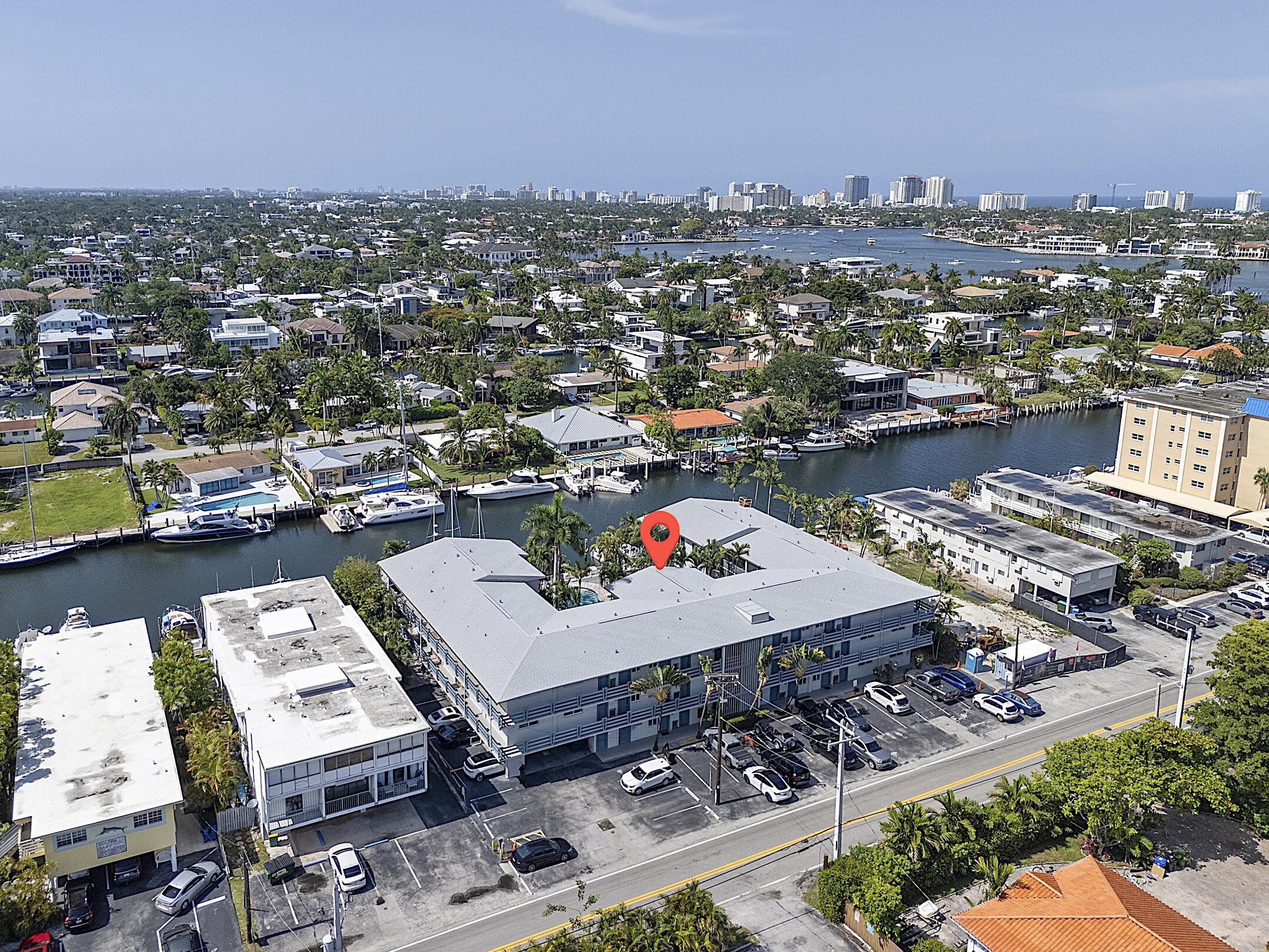 Rare waterfront living in this 2-bedroom, 2-bath overlooking the pool and canal in a boutique 22-unit building with direct Intracoastal access. Features include impact windows, new impact sliders opening to a private balcony, refinished hardwood floors, and a kitchen updated with 2024 stainless steel appliances. Canal views from your primary suite that includes an ensuite bath. Additional updates include a 2017 A/C and 2024 water heater. The building offers a brand-new roof, completed 40-year certification, and no current assessments. Dock space is available to rent or purchase for boats up to ~42 feet, with no fixed bridges to the Atlantic. 1 reserved parking space, guest parking, and pet-friendly living. Minutes from the beach, airport, and downtown!