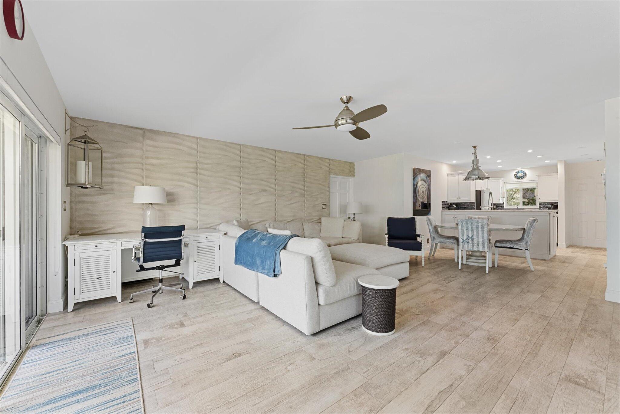 Enjoy coastal living in this beautifully maintained, fully turnkey residence with ocean views and direct beach access—just steps from both the beach and the pool. Updated with modern, sleek finishes throughout, the unit also features a cozy fireplace for added style and comfort. The layout includes a versatile second bedroom designed as a convertible den with its own private bathroom—perfect for guests or a home office. Relax and take in the ocean breeze from this inviting space, complete with an assigned parking spot (#62). Ideally located near shopping, dining, and local attractions, this property offers the perfect blend of convenience and seaside living. Don't miss this opportunity to own a stylish, move-in-ready ground-floor unit in a sought-after beachfront community.