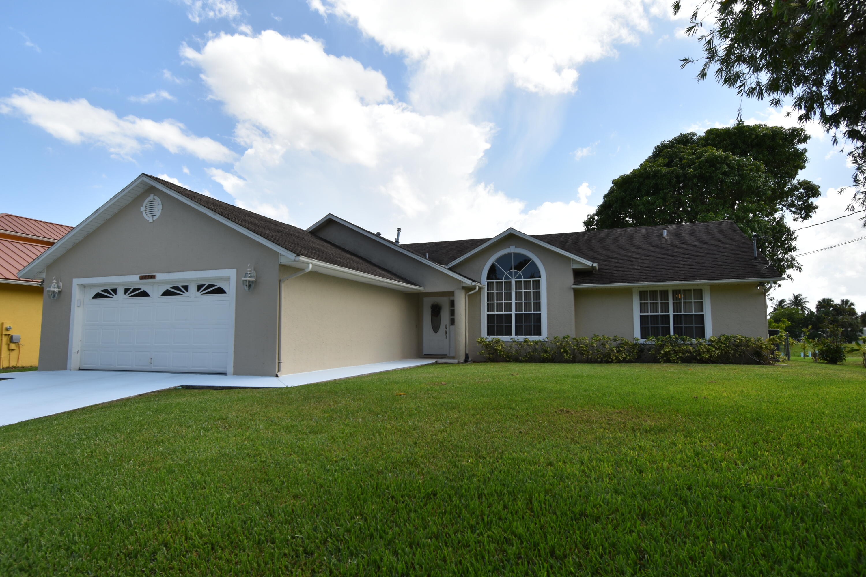 Discover this stunning 3-bedroom, 2.5 bathroom waterfront home in the family-friendly Oak Hammock neighborhood. Enjoy the peaceful sunrise or the vibrant sunset from your private dock overlooking the C-24 canal with 21 miles of navigable waterway, it's ideal for fishing and water skiing. Enjoy breathtaking views of ospreys diving for fish from your kitchen, dining room, or screened lanai. The extraordinary master suite features his and her walk-in closets and luxurious master bath with dual vanities, a large jetted Roman tub, and a separate walk-in shower.  The garage includes a convenient EV charging outlet.