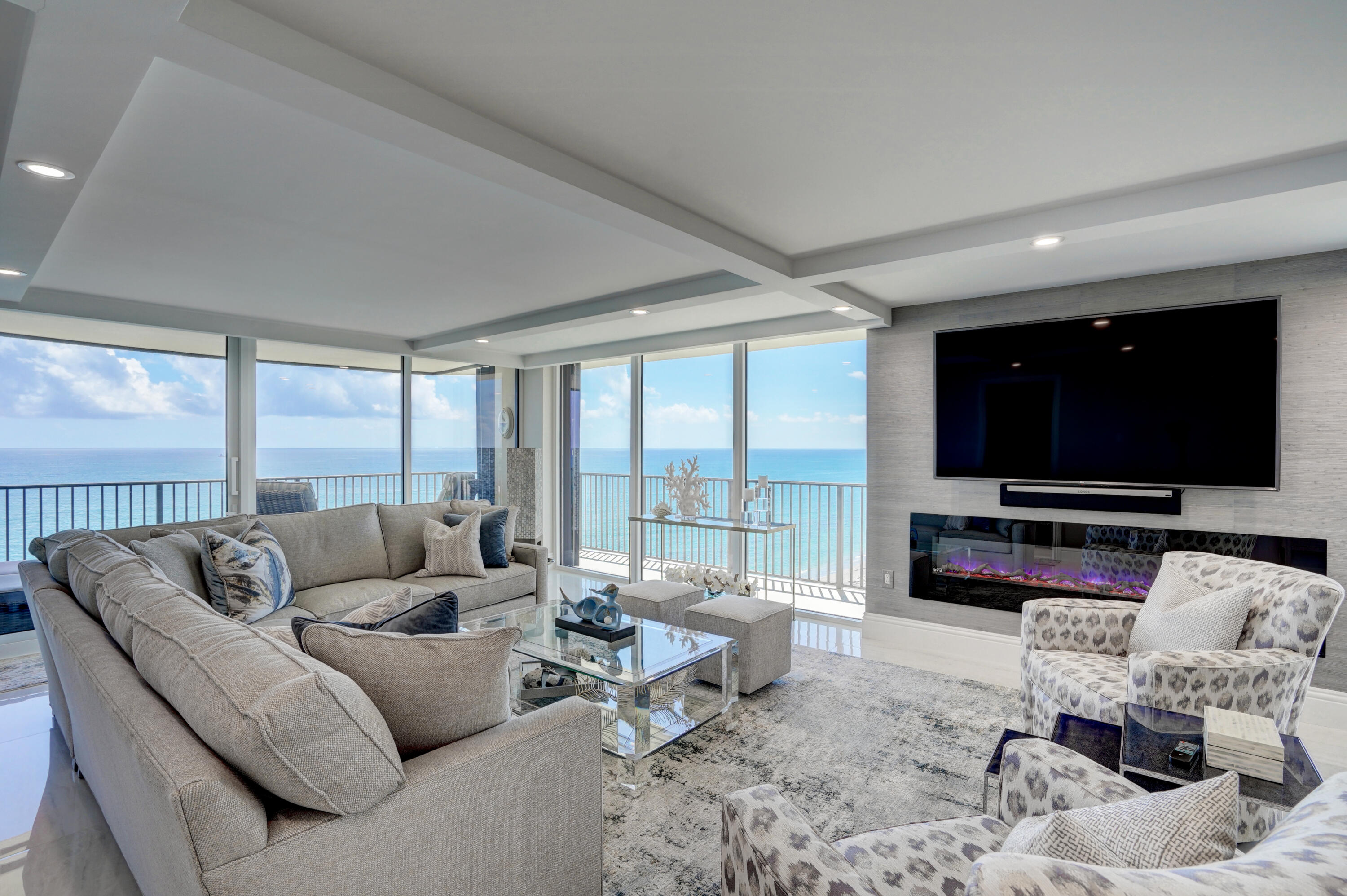 Fully Furnished Jupiter Island Tequesta Towers 10th floor unit. This Oceanfront/Intracoastal unit is the perfect match for anyone desiring the Jupiter Island Beach lifestyle. Completely renovated, this is a showcase home. Enter the wide foyer to an opened floorplan with views that are breathtaking.  With a wraparound balcony and Southern views, this allows the owner to view the famous Jupiter Lighthouse at night & the ocean all day. An opened kitchen with enlarged Center Island offers designer appliances like a Wolf Cooktop and oven with low profile exhaust, Bosch Refrigerator & Dishwasher, Sharp Island drawer Microwave, and Thermador Beverage drawers. All new Impact Glass as well as Brand new Accordion Shutters keeps this unit safe. The Master & guest bath are completely remodele Brand New A/C, new hot water heater, New Central Vacuum and a stacked Electrolux Washer & Dryer.  Solid doors thru-out. All windows are equipped with electric shades. This home even has large fireplace. This unit is better than new with new construction at double the price and a multi-year wait for completion. A new clubhouse nestled alongside the Towers offers a zero edge pool, with a club/gathering room and kitchen. The second floor treats owners to a fitness center with Ocean Views! A storage unit is included along with gated underground parking.