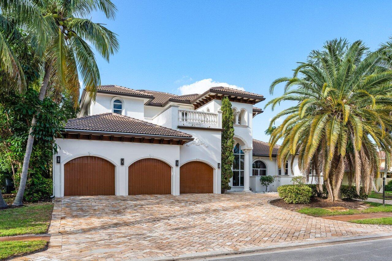 Welcome to this  5 BD 6.5 BA 5,020 SF magnificent estate, a blend of elegance and thoughtful design that offers comfort, luxury, and modern amenities. Situated on a lake, this home is in a prime location with stunning views.
Upon entering, you're greeted by a custom medallion inlaid in the marble floors, complemented by grand, custom-crafted wooden doors. The soaring ceilings in the main living area create an open and airy ambiance, complemented by floor-to-ceiling windows that flood the space with abundant natural light. Nearby, the formal dining room exudes sophistication with graceful arches and decorative columns, crafting an atmosphere of timeless class. See membership dues sheet attached. Capital contribution is now $25,000 effective July 1, 2025 In the kitchen, striking blue marble countertops make a bold statement against white cabinetry, elegantly detailed with a decorative trim. An extended counter creates an ideal gathering space, perfect for entertaining while cooking. Top-of-the-line appliances include a double gas stove and oven, a large sink, a built-in coffee machine, and a Sub-Zero refrigerator, ensuring a chef's paradise. Adjacent to the kitchen is a convenient, open walk-in pantry, offering ample storage.
A second family room features unique, coffered ceilings with custom LED lighting, highlighting its bold architectural design. Lighting continues to be a defining feature throughout the home, with strategically placed LED accents on the coffered ceilings in both living areas, the kitchen, the dining room, and even the grand chandelier above the entryway. 
Additional features downstairs include a cabana bathroom for poolside convenience and an office with built-in dark wood shelving and blackout blinds for privacy. The marble staircase, accented with gold and black railings, is a striking central feature leading to the second level. 
Upstairs, marble floors guide you to three additional ensuite bedrooms. One suite boasts both a separate tub and shower, and has access to a balcony through corner sliding doors. Additionally, there is hallway access to front and back balconies through sliding doors, offering a serene retreat and stunning lake views.
The outdoor area is a true oasis, with a sparkling pool, spa, and direct lake access framed by privacy hedges. Light tile surrounds the pool for a timeless, upscale aesthetic. Outdoor entertaining is effortless with a built-in grill and an indoor-outdoor patio area that seamlessly extends the living space.
The first floor primary suite is a retreat within itself, featuring corner sliding doors that open entirely for seamless indoor-outdoor living. Luxurious amenities include a dual-sided shower, separate vanities, a jacuzzi tub, and a private sauna room. A cozy fireplace, two walk-in closets, and additional storage spaces complete this lavish suite.
This home is a masterpiece of craftsmanship, balancing elegance with modern functionality for a lifestyle of utmost luxury.