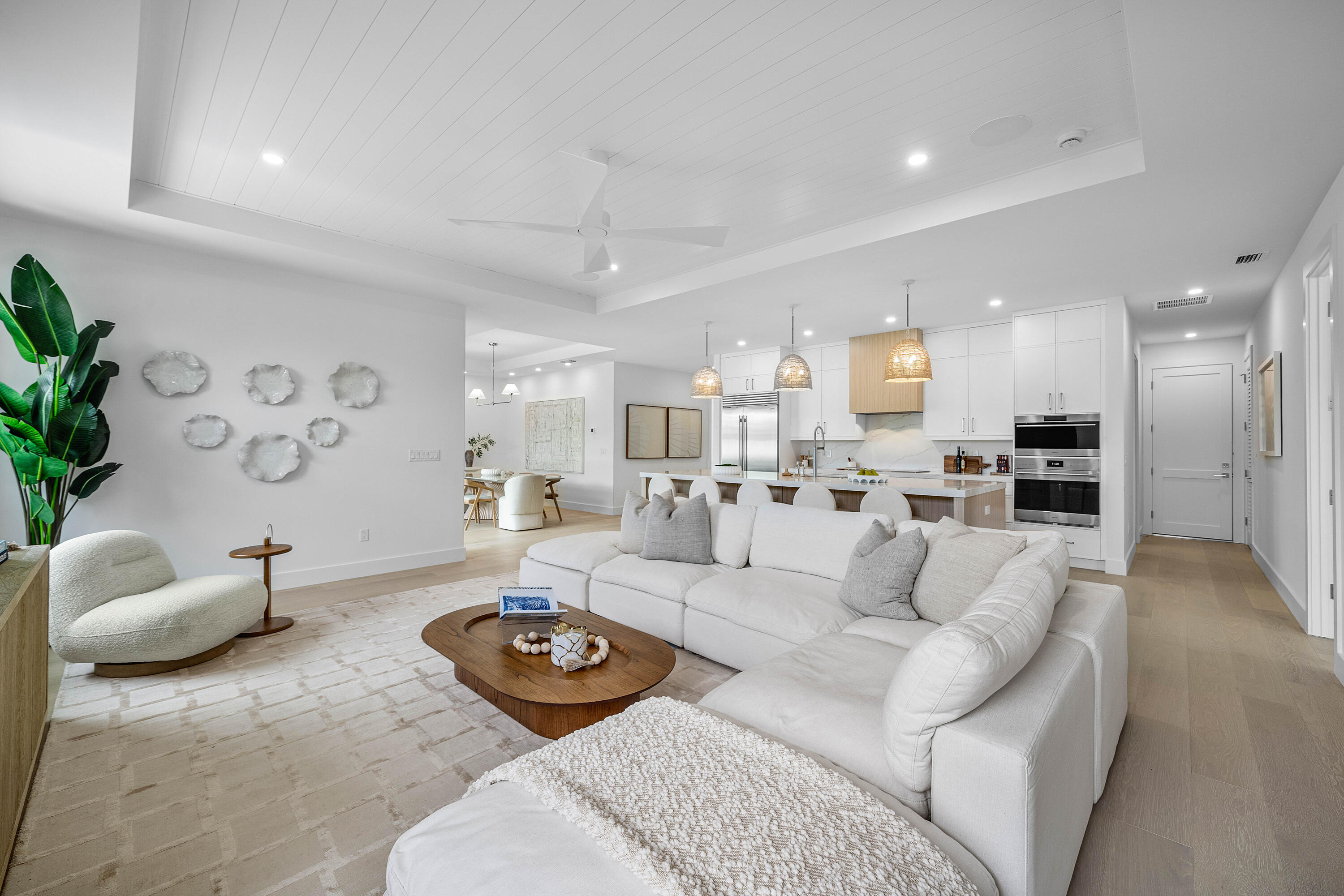Welcome to this stunning Coastal Contemporary residence located in the heart of Boca Raton within the highly sought after neighborhood of Boca Square, known for being zoned to some of Boca Raton's top rated schools. Newly completed in June 2026 by SAW Development, this brand new ground up construction showcases exceptional craftsmanship, nearly 10 foot ceilings, and a thoughtfully designed single story open concept floor plan.  The home features 4 spacious bedrooms with gracious closet space, including Jack and Jill bathrooms accompanying the guest suites, creating both comfort and functionality for family living and entertaining alike. The kitchen truly serves as the heart of the home, outfitted with premium Wolf and Sub Zero appliances, expansive bar seating, and seamless flow into the living and dining spaces.  Designed for effortless indoor outdoor living, the backyard retreat offers an oversized covered patio, brand new resort style pool, and an expansive turf lawn all surrounded by lush, private landscaping creating the perfect South Florida setting.