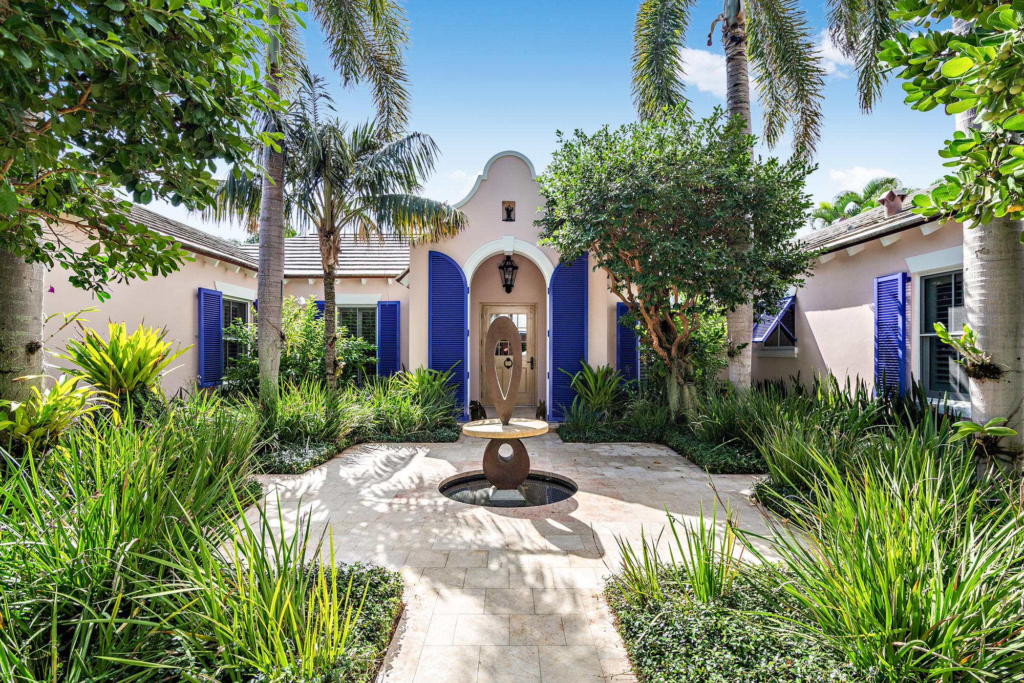 Beautifully renovated Bermuda style estate. Walk into paradise. This light filled 4-bedroom and 4-bathroom home situated in the near north end is ideal for entertaining. With its open floor plan, high tray ceilings and sliding glass doors one is led to lush gardens and a large pool area. This property is a tropical oasis. Included is deeded beach access and bicycle trail that is only moments away. This South facing home has an eat-in kitchen with lots of cabinet space and top of the line appliances. You and your guests will also dine in elegance in the large formal dining room or outside casually by the pool.The house also has a surprise feature of phantom screens throughout including the front door so one has fresh cross-ventilation at anytime. If it is privacy you are seeking, this is it! The landscaping is not only beautiful, but densely protective.