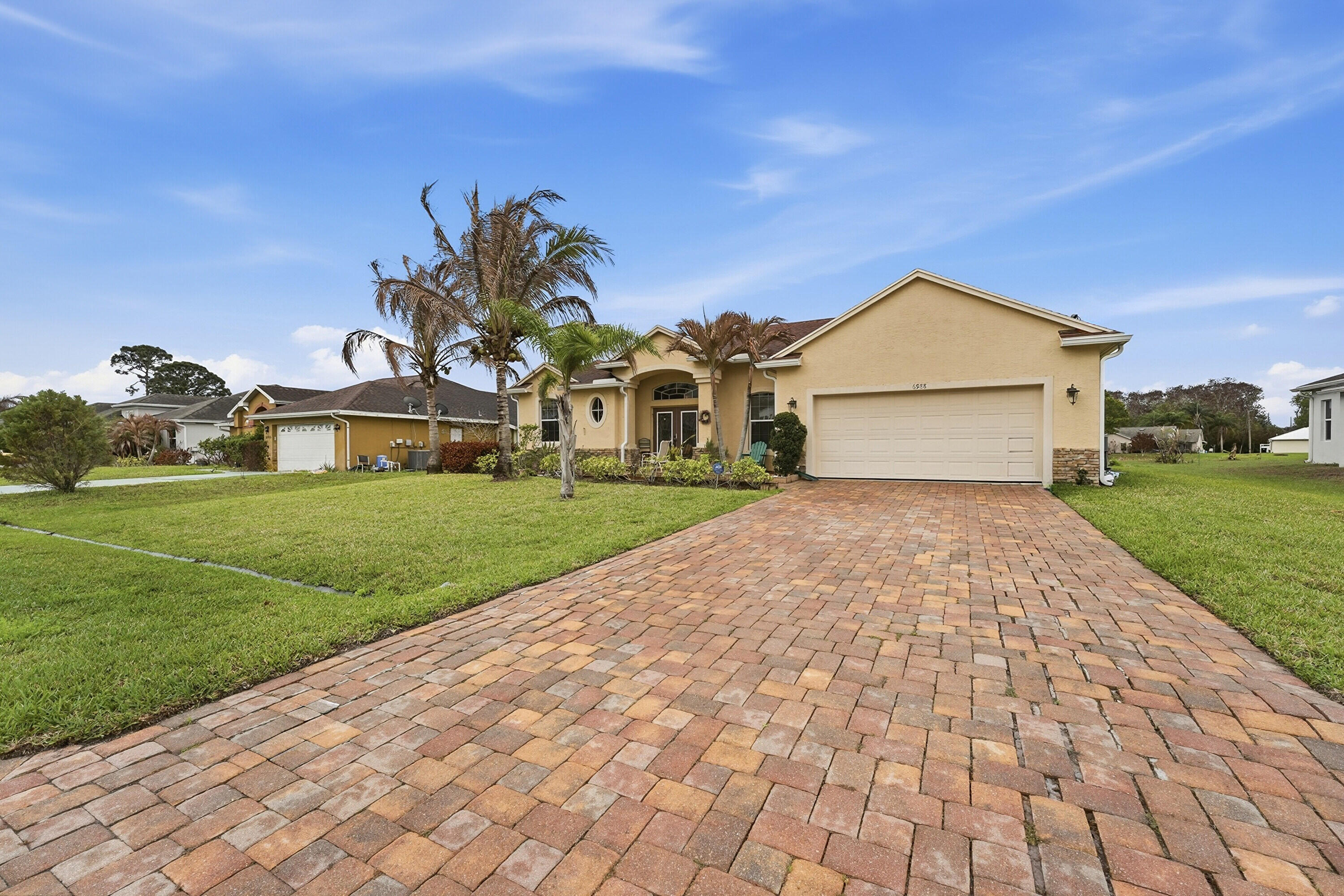 Charming home offering high ceilings, natural light and elegant French doors. Screened patio with jacuzzi, plus gutters, partial accordion shutter and no HOA