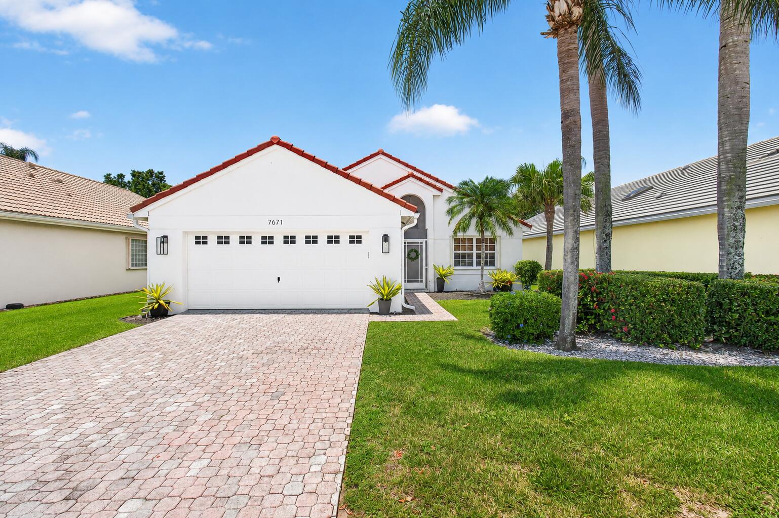 Enjoy peaceful lake views from this beautifully maintained home in the gated community of Newport Cove with low HOA fees. Major updates include a new roof (2023), A/C (2023), hot water heater (2018), and accordion shutters throughout for added storm protection and peace of mind. The spacious kitchen and bathrooms feature elegant granite countertops, combining style with everyday functionality. The light-filled floor plan offers comfortable living and effortless entertaining. Residents enjoy outstanding amenities including a clubhouse, resort-style pool, fitness center, tennis, pickleball, and an active social lifestyle. Conveniently located near shopping, dining, major highways, and vibrant downtown Delray Beach.
