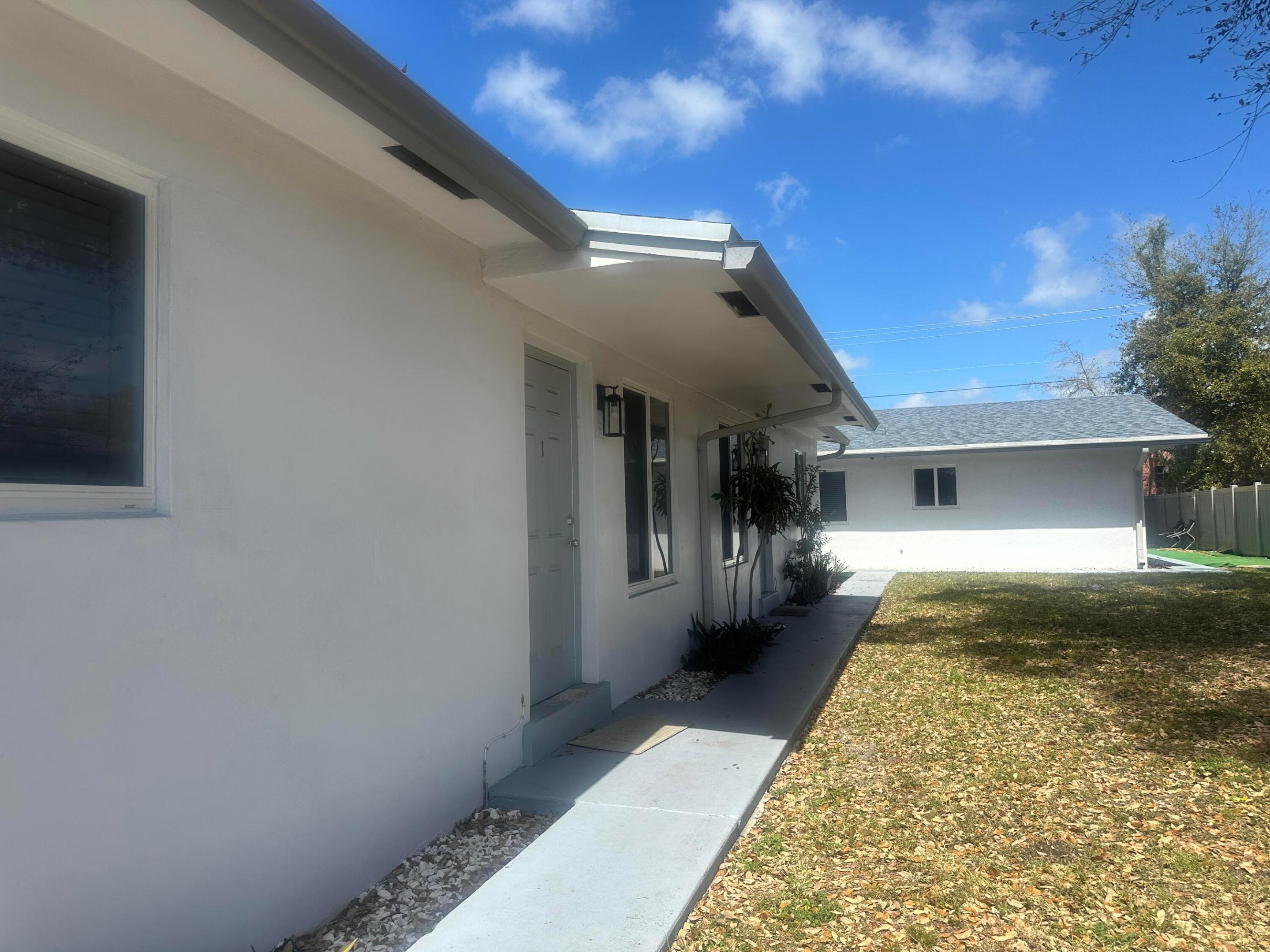 Hitting the market for the first time and a real money-maker! This gorgeous East Miramar fourplex, located in an Opportunity Zone, offers two separate buildings on one lot (one folio number, one legal description): the two units in the first building are 2 bedrooms/1 bathroom each, and the second building has two 2 bedroom /2 bathroom units. Recently painted inside and out, it features a brand-new roof (2023), new central air and heat, impact windows and doors, updated bathrooms and kitchen, plus upgraded electrical panels. Impeccably maintained, it's ideal for first-time buyers to live in one unit while renting out the other three, or for investors looking for a 1031 Exchange or a high rate on returns. Endless potential awaits!