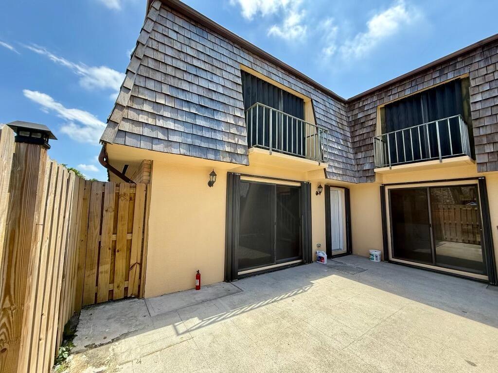 Welcome to this beautifully renovated turnkey property in Palm Springs, FL. This charming modern coastal townhome features a spacious open-concept layout with abundant natural light in every room, a modern designer kitchen with quartz countertops and stainless steel appliances. The interior includes two spacious bedrooms, each with a balcony view, and two full bathrooms. Enjoy outdoor entertaining within a privately fenced-in courtyard. Conveniently located next to the community park, nearby shopping, dining, and entertainment options, offering a blend of comfort and convenience.