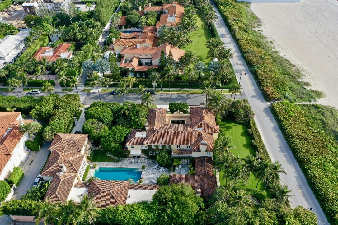 ICONIC Palm Beach | Rarely does one have the chance to purchase such an important estate on Palm Beach located on the corner of Main and Main.  Built originally in 1926 by renowned Palm Beach architect Marion Sims Wyeth, La Salona exudes true Palm Beach style. When one enters the arched entry courtyard, you're swept back in time.  Although originally built in 1926, the home has been completely updated under the current owner over the past 30 years. The most recent renovation of the western portion of the home was completed in 2016. The 2 stories include a 3-bedroom apartment on the first floor and another 3-bedroom apartment on the second floor. Distinctive features of the house include exquisite Cypress coffered ceilings, stenciled using a technique called lime paste. The decorative ironwork, the paneling and Mediterranean tile work dating back from Addison Mizner's workshop. The dining room features a coffered ceiling, carved columns, floor tiles and paneled doors which are all part of the original construction. This prestigious estate offers sprawling ocean views from the master suite along with 4 private guest suites and breathtaking courtyard gardens.  No other home In-Town exemplifies the classic Palm Beach with its timeless architecture.