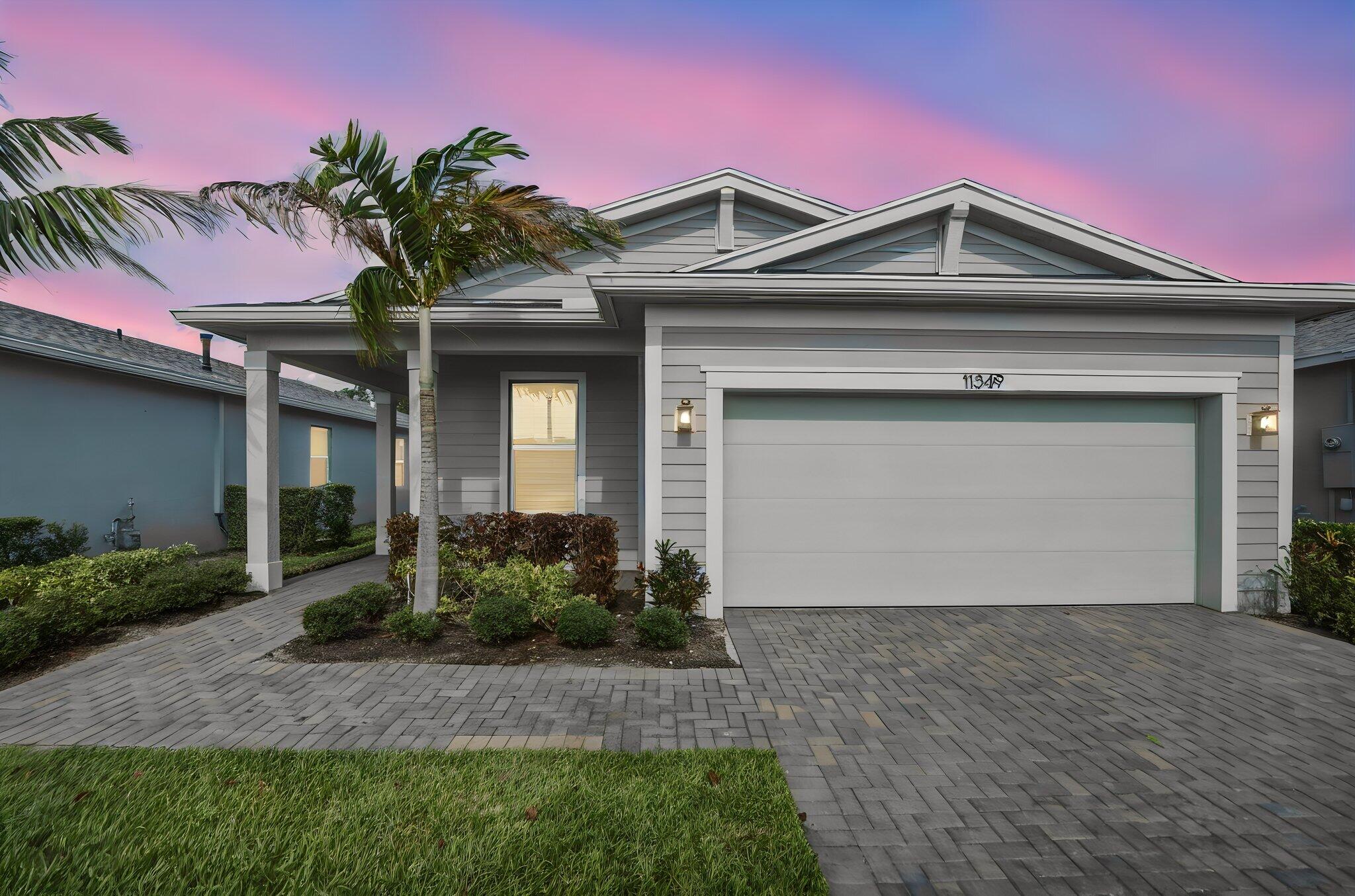 Live in America's #1 hottest ZIP code — 34987 in Port St. Lucie! Welcome to this beautifully maintained 2022-built single-family home in the sought-after gated community of Manderlie at Tradition. This 3-bedroom, 2-bathroom home offers the feel of brand-new construction while combining modern style, comfort, and energy efficiency. Designed with everyday living in mind, the home features impact windows and solar panels, providing the benefit of little to no electric bill. The open-concept floor plan is filled with natural light and includes stainless steel appliances, a spacious walk-in pantry, and a large primary suite that serves as the perfect private retreat. The primary bathroom is equipped with built-in Bluetooth speakers, allowing you to enjoy your favorite music or podcast.