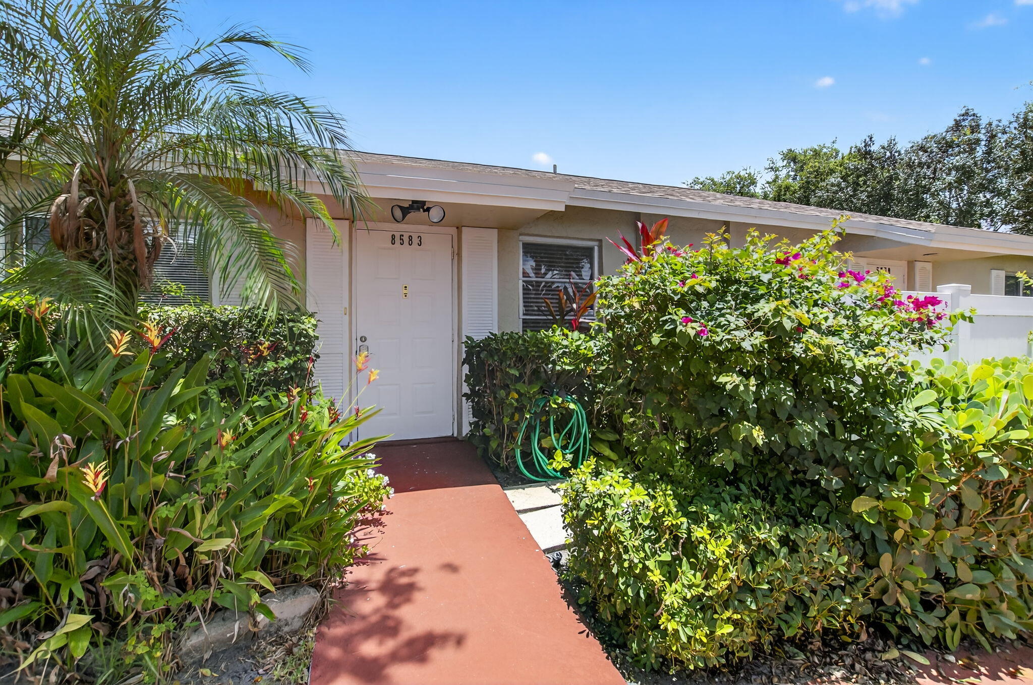 Whisper Walk is a 55+ community featuring many amenities.  This 2 bedroom 2 bath remodeled villa features new vinyl flooring throughout, new paint, bathrooms and kitchen  Awesome unit waiting for you to enjoy South Florida evenings on your screened patio.