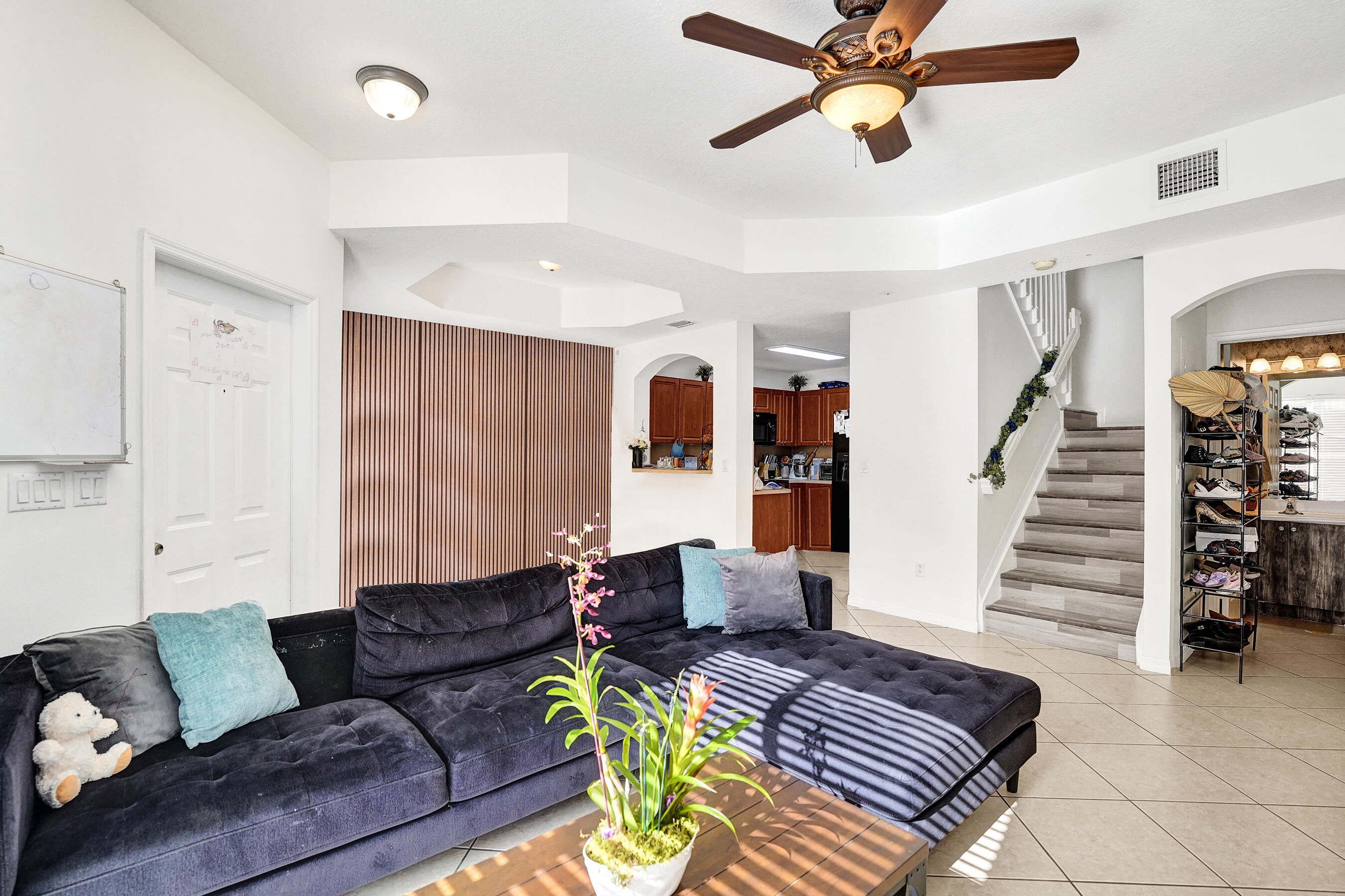 Located in a gated community, this home features tile flooring downstairs, new laminate flooring upstairs and on the stairway and plenty of natural light throughout for a bright, welcoming feel. The functional layout includes two bedrooms, each with its own private bathroom, plus a convenient half bathroom downstairs for guests. Enjoy the comfort of an in-unit washer and dryer, along with a large private front patio perfect for relaxing outdoors. Community amenities include a pool, outdoor gym, and playground. A new roof is also coming soon, adding peace of mind. Can rent immediately, making this an excellent option for investors looking for rental income from day one.