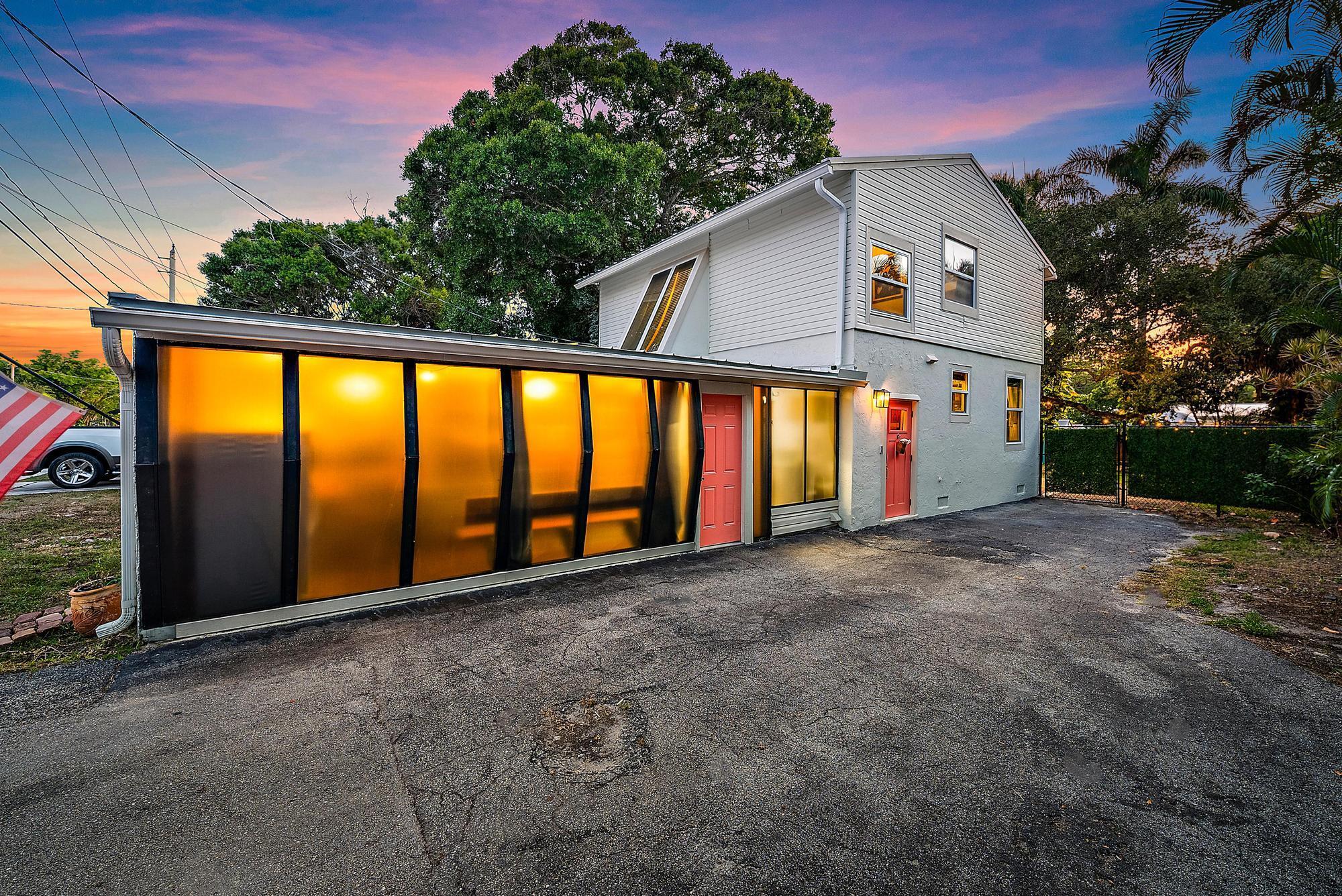 Two miles to the ocean, with no HOA.  A 2019 standing seam metal roof, newer HVAC, and impact windows and doors throughout.  Old Florida character inside - Saltillo tile, refinished beams, crown molding - with remodeled baths and an updated kitchen.  Approximately 1800 sf;  3 bedrooms with generous closets, 2.5 baths with stone floors and quartz countertops, and an open eat-in kitchen with a 10' impact slider.  A towering oak tree shades the fenced lot, which has a brick paver patio and an outdoor shower.  This home also has a screened in patio on the side, giving you plenty of options.  Make this charming home yours!!