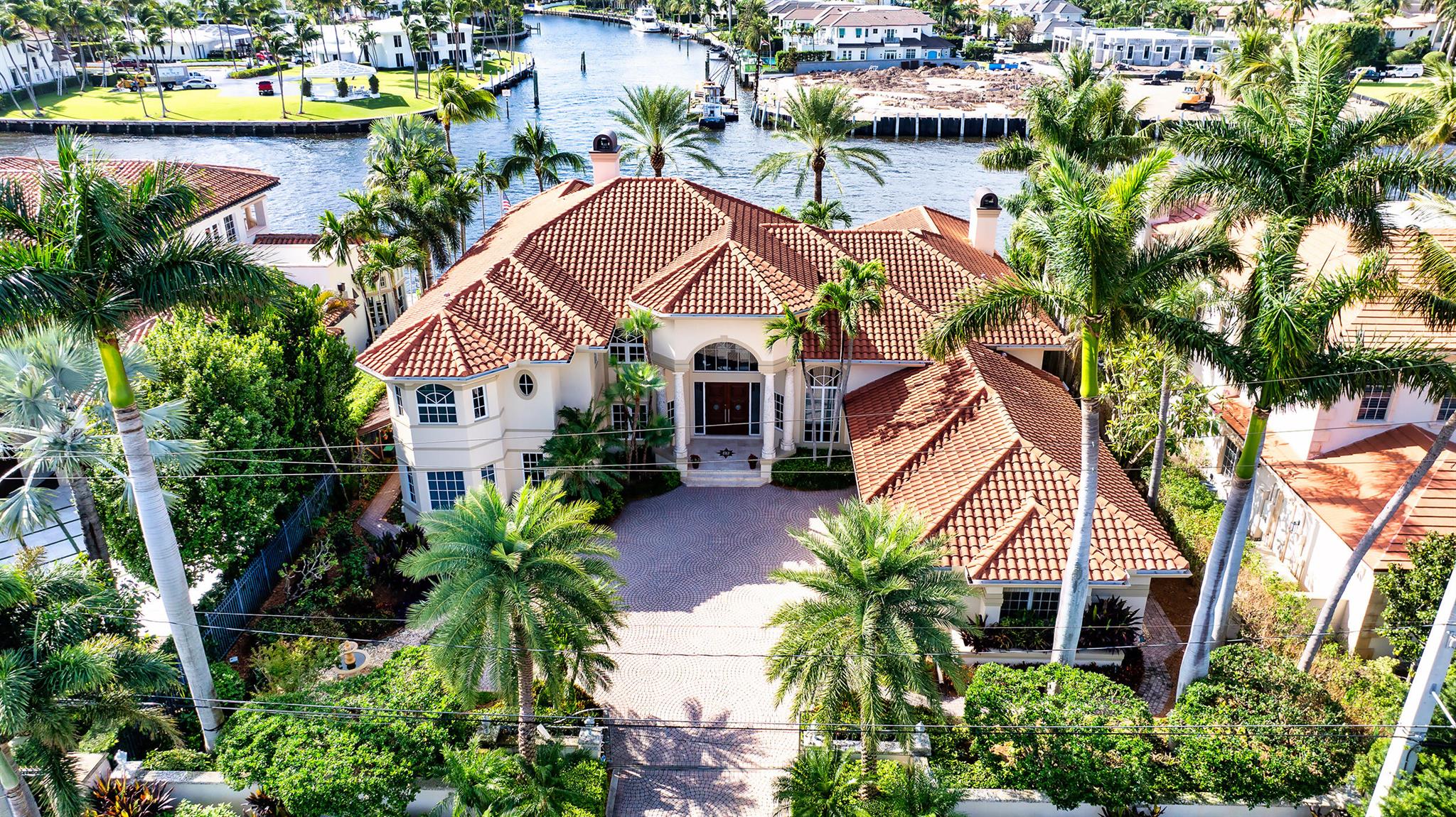 Extraordinary and unobstructive sweeping views of the Intracoastal Waterway and Grand Canal to Royal Palm Yacht & Country Club highlight this gated Mediterranean-inspired estate residing on 100± feet of shoreline. Majestic landscaping adorns the impressive entrance, custom paver motor court and the resort-inspired outdoor entertainment space that stretches across the entire water side of the residence. The luxurious pool with spillover spa is framed by a grand loggia and tiered terraces served by a summer kitchen/bar.

Greeting guests with a dramatic double door entry, the five-bedroom residence flows flawlessly to host gracious entertaining and capture the beauty of the endless glistening waterway and colorful tropical garden views from all major rooms. At the heart of the house, the 2-story salon combines refined formality with inviting elegance of marble floors and window walls of glass.

LOCATION
Spanish River Road, Boca Raton, Florida. The residence enjoys a sought-after address in the estate section, Old Boca Raton's finest beachside enclave. Beautiful beaches and the renowned Boca Raton resort lie minutes away. Also close by are Mizner Park's world-class shops and restaurants and Boca Raton's executive airport.

Property
Wide-open views sweep over the Intracoastal Waterway from this gated estate on 100± feet of shoreline.  Elegant landscaping adorns the expansive entrance court and the resort-inspired outdoor entertainment space that stretches across the entire water side of the residence.  Here, the luxurious pool with spillover spa is framed by a grand loggia and tiered terraces served by a summer kitchen/bar.

Residence
This impressive custom-built residence of 7,407± total square feet include five bedrooms, five and a-half baths, an elevator, and a side-entry three-bay garage.  Beautiful marble finishes are featured.  All windows and exterior doors have impact-rated glass.

First Floor: Through the glass-arched entry, the column-framed marble gallery foyer steps into the stunning two-story living room where a sunlit window wall opens to the terrace and spectacular waterfront view.  Off the dining room is the professional bar, guest powder room and the grand staircase.  Appointed with custom cabinetry, granite counters, and hardwood flooring, the gourmet kitchen shares an expansive open space with the waterfront breakfast area and family room with custom built-ins and French doors to the terrace.  Off the kitchen is a laundry room and utility room that leads to the 3-bay garage.  Across the gallery, the custom-fitted office/library has handsome hardwood finishes and full bath.  The three private guest suites complete this level.

Second Floor:  In the dramatic bridge hallway, overlooking the living/dining rooms below, double doors enter the grand primary suite's private wing.  Wraparound glass walls give the primary bedroom breathtaking panoramic and distant waterway views and access to balconies.  A luxurious realm, the primary quarters also feature a sitting room, a double wardrobe room, dual vanities and large marble bath with soaking tub and separate water closet.  


DISCLAIMER: Information published or otherwise provided by the listing company and its representatives including but not limited to prices, measurements, square footages, lot sizes, calculations, statistics, and videos are deemed reliable but are not guaranteed and are subject to errors, omissions or changes without notice. All such information should be independently verified by any prospective purchaser or seller. Parties should perform their own due diligence to verify such information prior to a sale or listing. Listing company expressly disclaims any warranty or representation regarding such information. Prices published are either list price, sold price, and/or last asking price. The listing company participates in the Multiple Listing Service and IDX. The properties published as listed and sold are not necessarily exclusive to listing company and may be listed or have sold with other members of the Multiple Listing Service. Transactions where listing company represented both buyers and sellers are calculated as two sales. "No payments made until title passes" Some affiliations may not be applicable to certain geographic areas. If your property is currently listed with another broker, please disregard any solicitation for services. Information published or otherwise provided by seller, listing company or its representatives is deemed reliable but are not guaranteed and subject to errors, omissions, or changes without notice. Copyright 2024 by the listing company. All Rights Reserved.