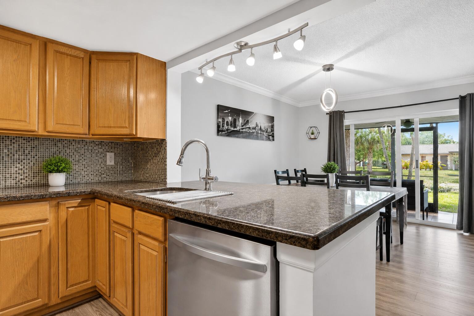 MOVE IN READY!! RENOVATED 3-Bedroom, 2.5-Bathroom Townhouse in Coral Springs. This beautifully updated townhouse features NEW FLOORING, 2023 ROOF. The kitchen boasts granite countertops, a built in water filtration system, and 2023 stainless steel appliances. The master suite includes a private balcony! Additional upgrades are  2024 AC, 2023 water heater, 2023 washer/dryer, and HURRICANE IMPACT WINDOWS AND SLIDERS (2023). The screened-in porch overlooks a peaceful canal and grassy area, perfect for outdoor grilling. Community amenities include a private pool and hot tub, and HOA fee covers water. Located near schools, dining, shopping, and Coral Square Mall. 10% down & 650 credit score required. Schedule your showing today!