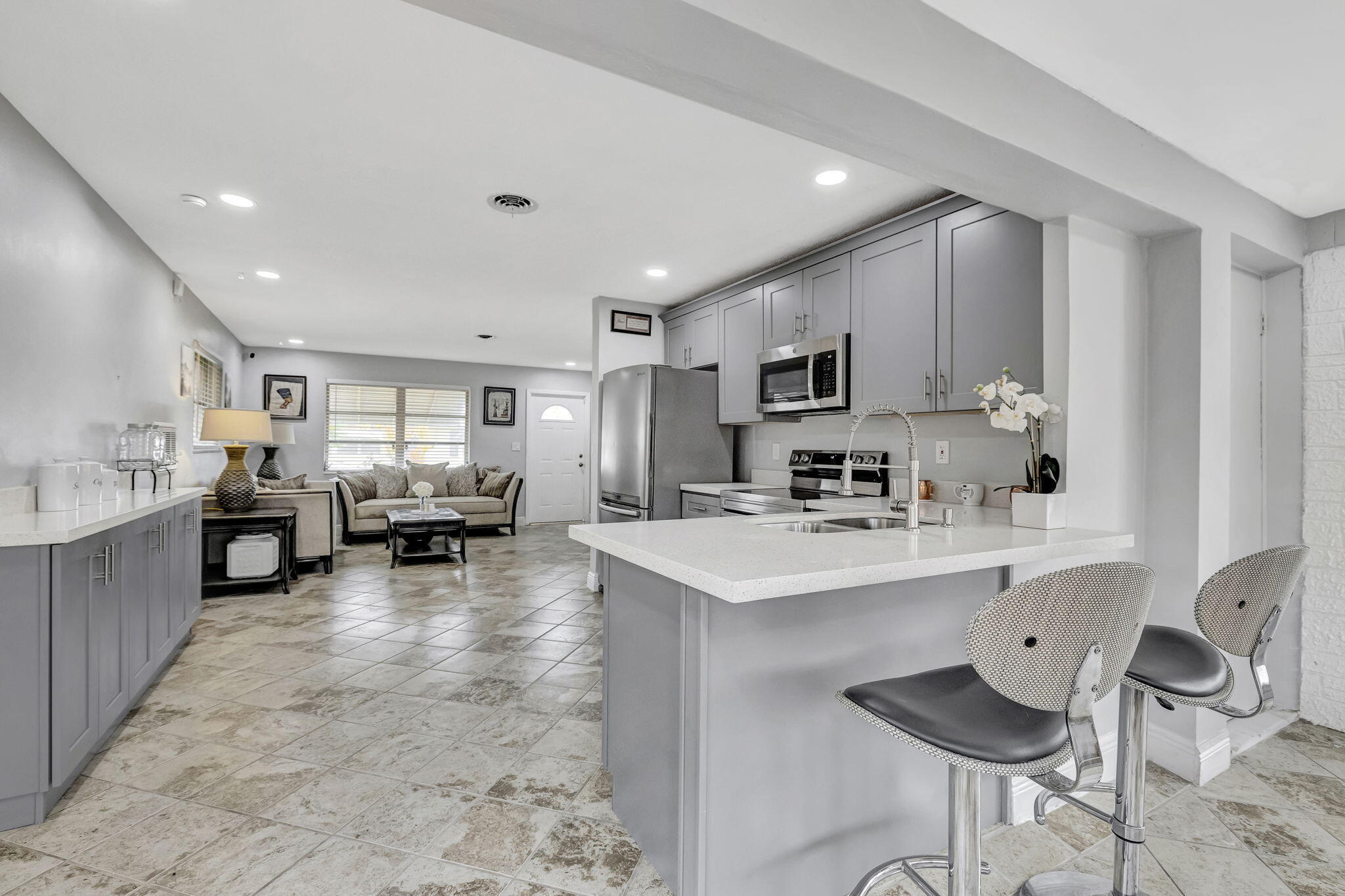 Outstanding updated 2 Bed 1 Bath single family home located in the heart of Fort Lauderdale. Boasting a spacious kitchen & living area for entertaining, fine cooking, & dining. Enjoy peace & serenity in the comfort of the fenced in backyard, by the patio, firepit, or under the shade of the trees watching TV. Take a walk in this quite community, or hangout poolside at the clubhouse. Free & included 9-hole golf course within the community to indulge in as many rounds as you like. Make this home your oasis! The community is minutes from major highways & shopping centers which is ideal for commuters, short trips to the beach, & everyday necessities. This is a turnkey rental. All you need is your toothbrush and towel!