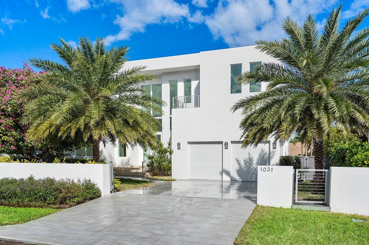 High end, modern design merges with superb attention to detail in this spectacular 2020 built waterfront home. Light filled contemporary living only a half block from the beach and within a mile of shopping and dining. This is an impeccably planned, uniquely built custom home that exists as a result of a brilliant collaboration between artist homeowner and Architect George Brewer. Simplicity of design creates balance, harmony, and connection with the beautiful natural landscape. 12 ft. ceilings and walls of windows invite the outdoors in and spill an abundance of natural light into every corner of this masterfully crafted home. Situated on 75 feet of waterfront and spanning 5,364 square feet under air, this home provides privacy and serenity just minutes from the lively possibilities of beach and town. Luxurious details and finishes impress, including marble flooring, Chef's kitchen complete with Sub Zero and Miele appliances, luxurious cabinetry by Eggersmann, walk in pantry, and natural gas, full house water filtration system, 4 deluxe commercial Lennox air conditioners, a whole house generator, and a seamless outdoor porcelain patio and dock. Textured porcelain simulates natural stone in contrast to luxurious polished marble throughout the home as well as outdoors. Multiple living areas, a guest suite and a library round out the living space on your first level. The newly planted, lush landscaping and the sleek, 50 foot long heated lap pool help to create a picture perfect outdoor space for you and your guests to use year round. Let the gorgeous light filled stairway or the convenient elevator lead you upstairs to the second level. Here, the master retreat has gorgeous views of the water from the bedroom which is expanded by the spacious upper balcony. Sleek finishes of marble and wood in the master bath complement one other to create a functional yet private oasis. Soak in the Jacuzzi tub and gaze out at the extraordinary Hong Kong Orchid tree from the private and intimate master bathroom balcony. The true gem of this home is the one of a kind bonus room upstairs currently being used as an art studio. Three walls of glass surround the space in natural light and lead seamlessly out to the large balcony overlooking the sparkling play of the Intracoastal Waterway. A functional kitchenette and several closets help to make this room adaptable to any use. Perfect for a club room, home office, flex space or guest room. This flexible space helps meet the needs of even the most discerning buyer. The second floor is made complete by a spacious ensuite bedroom with its own private balcony, and laundry room. The dynamic, playful flow of space in this home is apparent from the moment you walk in. In each room, there is an integral oneness with the beauty of nature. Easy access to Delray Beach's lively Atlantic Avenue and all the conveniences and shopping just over the bridge make this location the perfect place to call home.