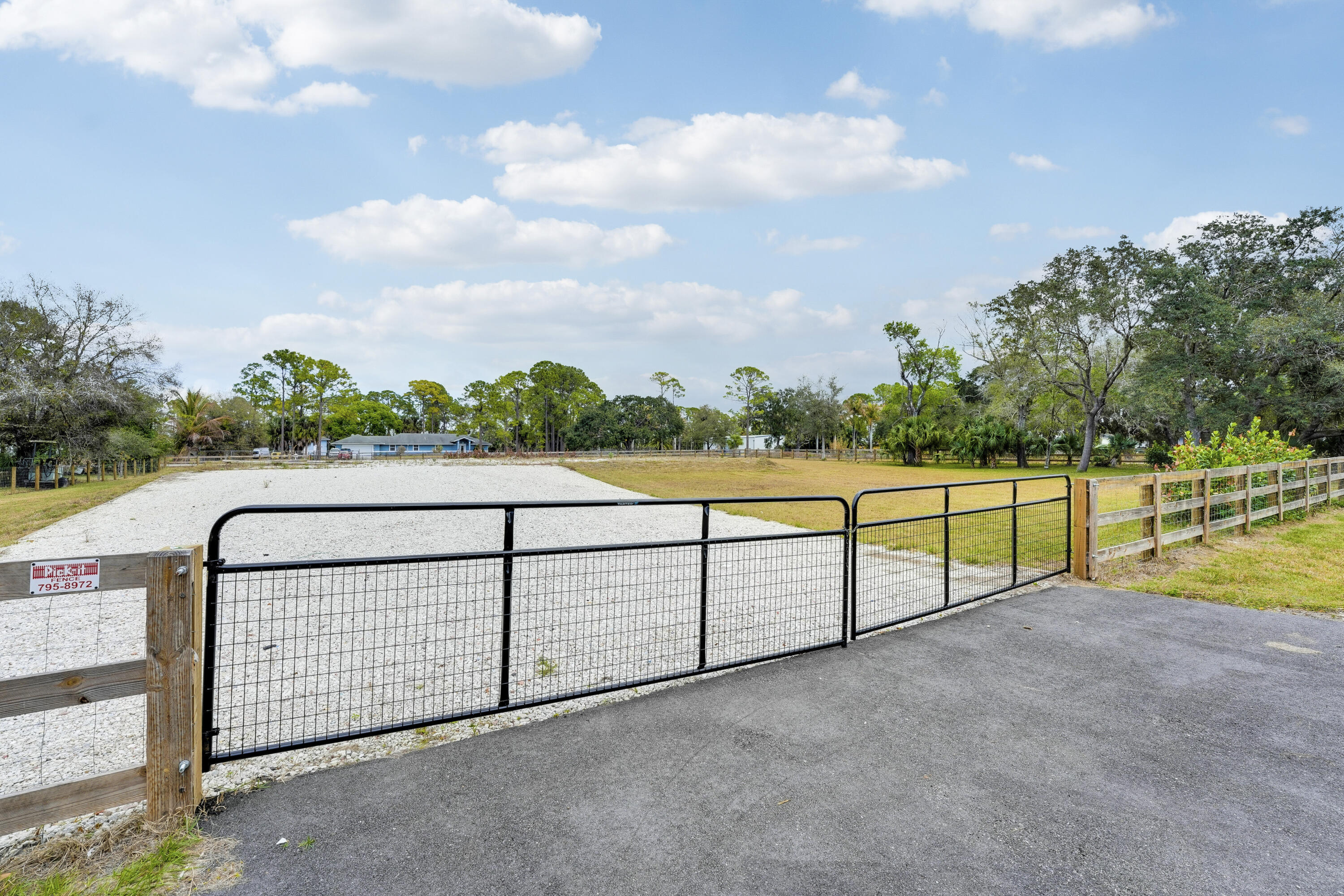 Discover an exceptional opportunity to build your dream home on this beautifully improved 1.48-acre lot located on a quiet paved dead-end street in The Acreage. This property offers privacy and convenience with new perimeter fencing and gates, two blacktopped gated entrances. Ideal for a custom estate with room for a pool and outdoor amenities, all while enjoying a peaceful setting with easy access to shopping, dining, and schools in Palm Beach County. A rare, ready-to-build opportunity you won't want to miss. Muck was identified on the site and has been removed. Soil test available upon request.