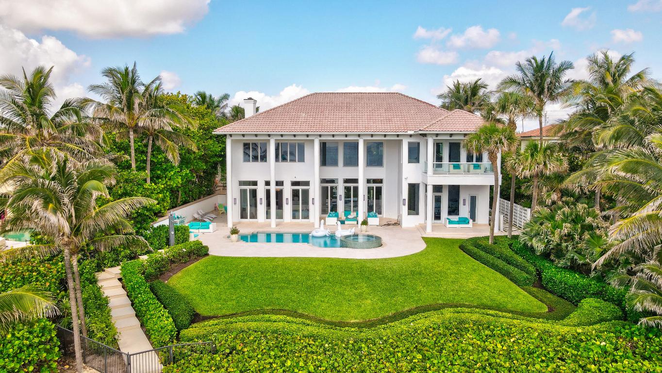Unique oceanfront masterpiece in the highly sought after private estate section of Delray Beach. Just a short walk to the public beach boardwalk and nearby Atlantic Avenue restaurants, this home is as stunning as it is secure, boasting a reinforced concrete frame and hidden dune sea wall. Impact glass windows and doors throughout. The property features 8448 sqft, 8 spacious bedrooms, 6 full baths, 30 foot ceilings, abundant natural light and an inviting, open floor plan.

The Kitchen is loaded with top of the line Miele & Subzero appliances, custom cabinetry, and an oversize island perfect for entertaining. The floor-to-ceiling glass doors on the main level overlook a lush tropical manicured garden; complimented by the tranquil turquoise ocean that graces the backyard.
RENOVATED in 2013