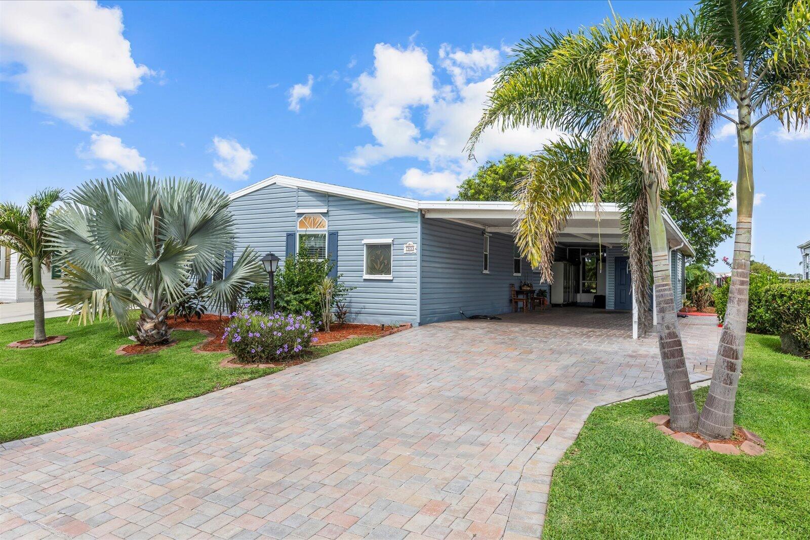 Wake up to beautiful golf course views in this sought-after Islander III model located in the amenity-rich Savanna Club 55+ community! This well-maintained home offers 2 spacious bedrooms, 2 baths, plus a versatile den that's perfect as a home office, hobby room or guest space. The open kitchen features granite countertops and flows seamlessly into the living areas with attractive laminate flooring throughout. Outside, enjoy exceptional curb appeal with a paver driveway, welcoming front porch, and an expansive paver patio—perfect for entertaining, relaxing, or taking in the peaceful golf course setting. Experience the Florida lifestyle with resort-style amenities, clubs, golf, pools, fitness, dining, and more! Land Lease Property