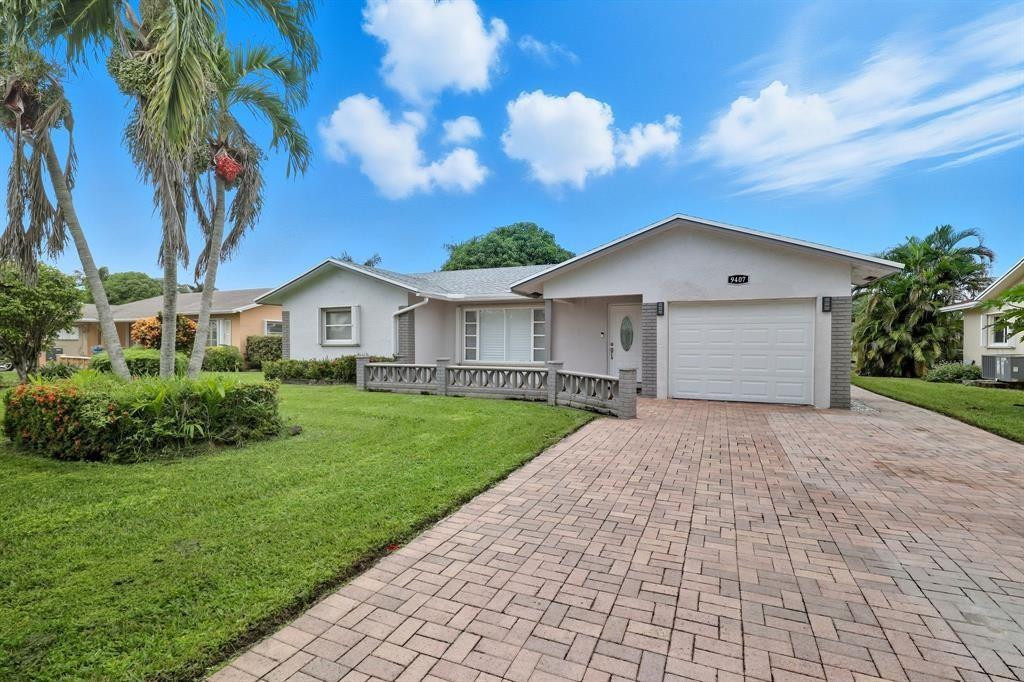 LOCATION, LOCATION Enjoy serene waterfront living with amazing sunset views in this completely upgraded home located on a quiet lot in Tamarac’s desirable Westwood 4 (55+) community. Backing to the huge main canal, the home features a screened covered lanai for relaxing evenings. Inside offers a renovated kitchen, updated bathrooms, tile & vinal flooring, plantation shutters, dedicated office space, & a spacious walk-in dressing room. Recent updates include a new roof (2021) AC (2019) hurricane accordion shutters, fresh paint, & security system. Mature landscaping includes a 50+ year-old mango tree & hibiscus tree. Community amenities include an Olympic-sized pool, clubhouse, fitness center, active social calendar, and low $100/month HOA. Move In Ready, You must see the gorgeous home!-- LOCATION, LOCATION Enjoy serene waterfront living with amazing sunset views in this completely upgraded home located on a quiet lot in Tamarac’s desirable Westwood 4 (55+) community. Backing to the huge main canal, the home features a screened covered lanai for relaxing evenings. Inside offers a renovated kitchen, updated bathrooms, tile & vinal flooring, plantation shutters, dedicated office space, & a spacious walk-in dressing room. Recent updates include a new roof (2021), AC (2019), hurricane accordion shutters, fresh paint, & security system. Mature landscaping includes a 50+ year-old mango tree & hibiscus tree. Community amenities include an Olympic-sized pool, clubhouse, fitness center, active social calendar, and low $50/month HOA. Move In Ready, You must see the gorgeous home!