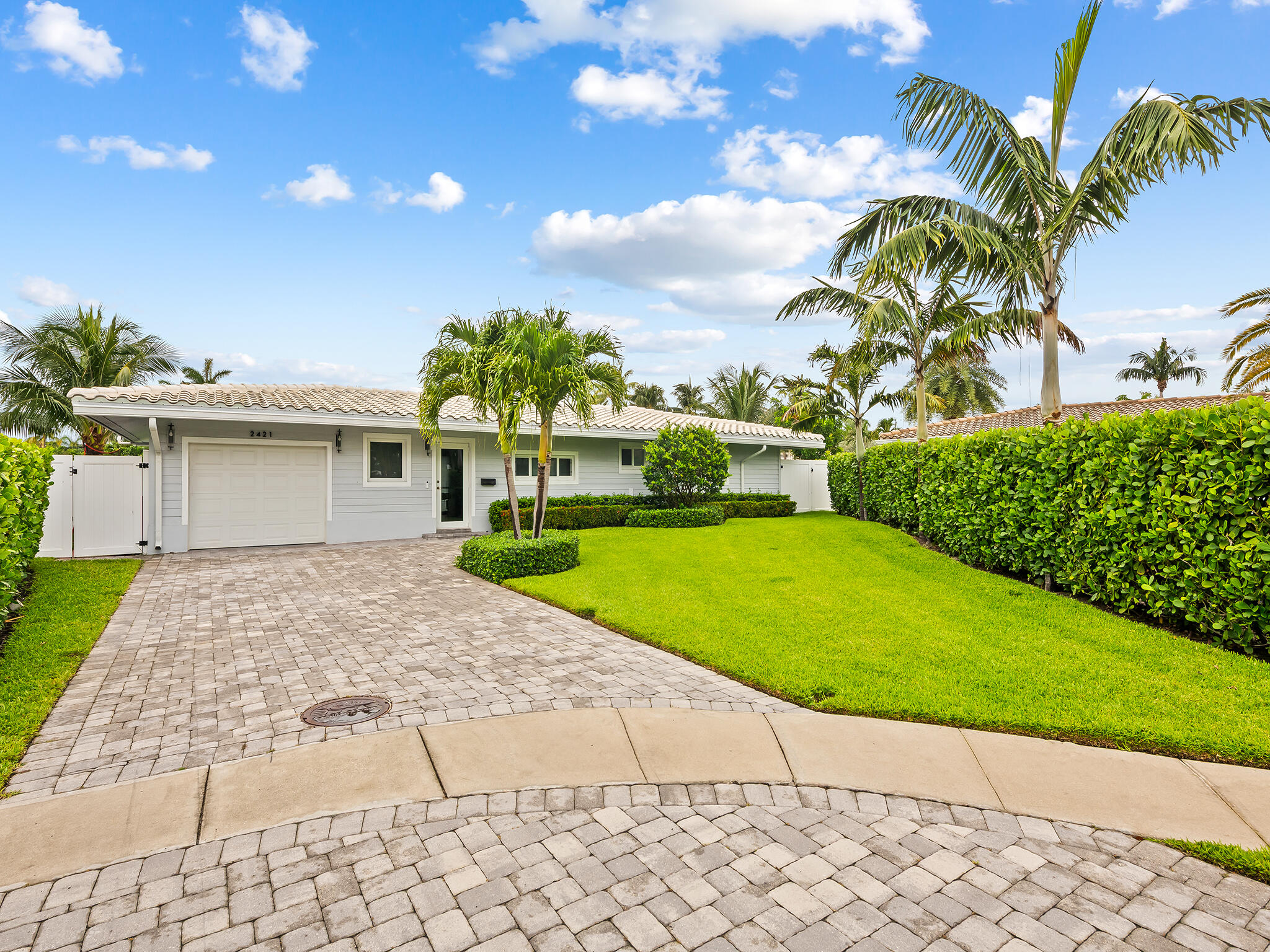 Nestled on an oversized corner lot in the coveted Coral Key Villas neighborhood, this fully reimagined waterfront retreat offers 134 feet of water frontage with two separate docks — a true boater's paradise. Whether you're cruising to the Intracoastal or simply enjoying the sweeping water views from your backyard, this home delivers the South Florida lifestyle at its finest. Completely renovated in 2021, no detail was overlooked. The interior was rebuilt with all-new everything — from the designer kitchen and luxury flooring to impact windows and sliders throughout. The newly remodeled pool and new seawall cap, batter pilings add further peace of mind and long-term value. What sets this property apart is the combination of location, lot size, water frontage, and quality of the renovation.