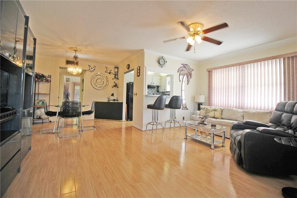 BRIGHT AND AIRY CORNER UNIT!! THIS 1 BEDROOM, 1.5 BATH ON THE 2ND FLOOR BRINGS IN ALL THE LIGHT!! MOVE RIGHT IN TO THIS FULLY FURNISHED CONDO WITH BEAUTIFUL LAMINATE AND TILE FLOORS! THE KITCHEN FEATURES GRANITE COUNTER TOPS AND TILE BACKSPLASH!! WALK TO POOL & TENNIS COURTS! HAVE A CUP OF COFFEE ON THE ENCLOSED PATIO WITH TILE FLOORS & GARDEN VIEW! NOTHING TO DO BUT BRING YOUR CLOTHES AND ENJOY THE SOUTH FLORIDA LIFESTYLE!! CENTURY VILLAGE EAST IS A 55+ COMMUNITY WITH FREE TRANSPORTATION INSIDE AND OUT!  THIS GATED COMMUNITY ALSO FEATURES A FABULOUS CLUBHOUSE  WITH CLASSES, CLUBS, FREE MOVIES, BROADWAY SHOWS & STATE OF THE ART GYM! CLOSE TO THE BEACH, FABULOUS SHOPPING, MAJOR HWYS AND GREAT RESTAURANTS! ASSOC. CLAIMS 55+