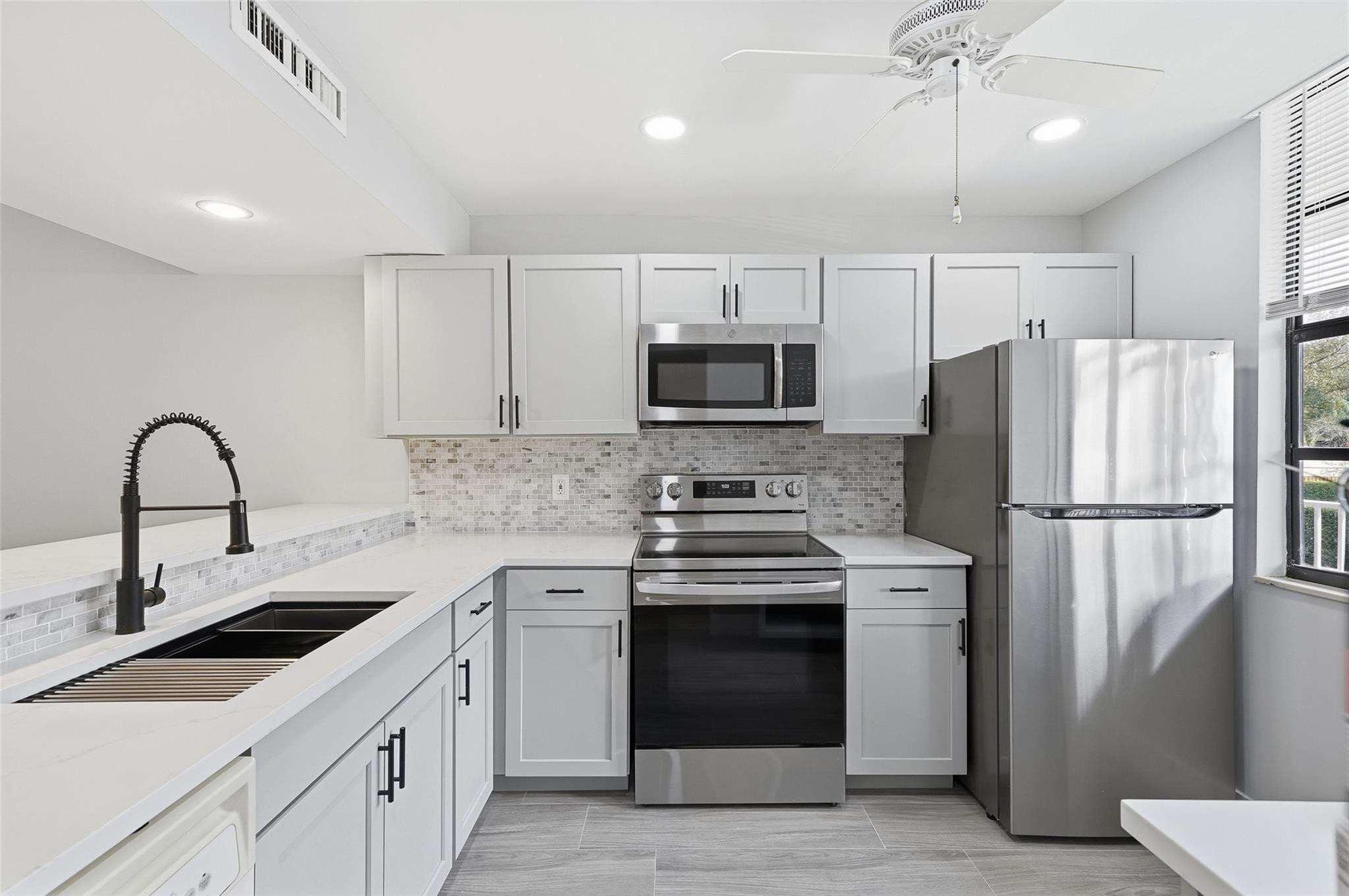 Spacious 2-bedroom, 2-bath condo in the heart of Davie! Ideally located near Nova Southeastern University, major highways, shopping, and dining. This desirable unit offers one of the largest floor plans in the area, featuring an additional den—perfect for a home office, study space, or extra storage. Enjoy the convenience of a full-size washer and dryer in the unit, along with a newer A/C unit. The highly sought-after Whitehall community is well maintained and known for its welcoming atmosphere and resort style amenities. No known pending assessments, rent right away. Impact windows on order.  Don’t miss this fantastic opportunity to own in one of Davie’s most desirable communities!