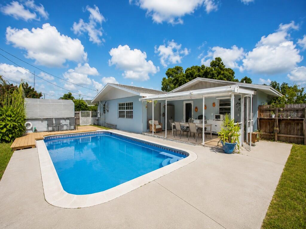 Don't miss this charming 2,325 sq. ft. CBS pool home in Orange Blossom Estates. This 3-bedroom, 2-bathroom residence welcomes you into a covered front porch perfect for greeting guest. The inside of  the house features tile flooring throughout, formal dinning and living room and open kitchen and separate laundry room. Master bedroom offers private access from the front porch, while the flexible layout includes an optional 4th bedroom with back porch access and a guest-ready bonus room located conveniently off the kitchen.The outdoor space is ideal for entertaining, featuring covered porch with large fenced patio, pool, deck, and a storage shed. Centrally located near schools, hospitals, and shopping, this property offers exceptional comfort and convenience.