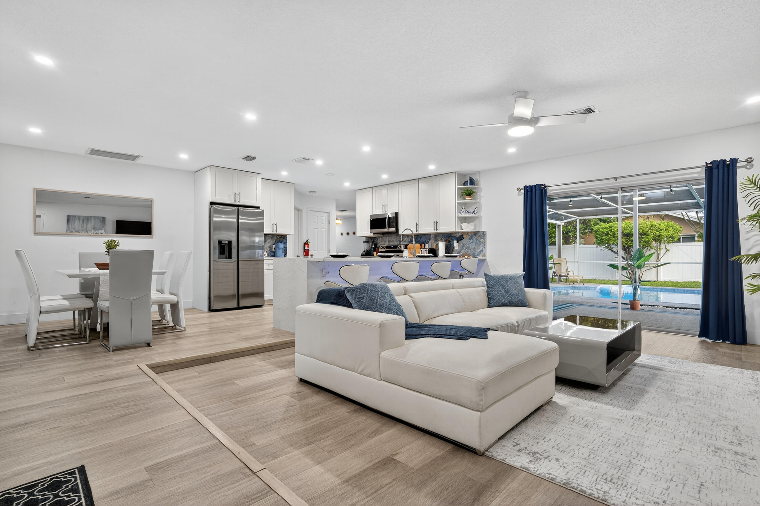 Turnkey, fully remodeled, and zero restrictions—this Coconut Creek property is an investor's dream or your forever home. This 3-bedroom, 2-bath home features luxury vinyl flooring throughout, upgraded bathrooms, and a modern layout designed for durability and appeal. The kitchen is New & a chef's dream with quartz counters, ss appliances, Real Wood cabinets and a stunning backsplash!  Currently optimized for Airbnb hosting, allowing for immediate income generation. With no HOA, no rental restrictions, and a two car garage, this home offers rare flexibility for short term, mid term, or long term rental strategies. You're minutes from major highways, shopping, dining, and parks—high demand conveniences that keep occupancy strong and returns consistent. You don't want to miss this one!
