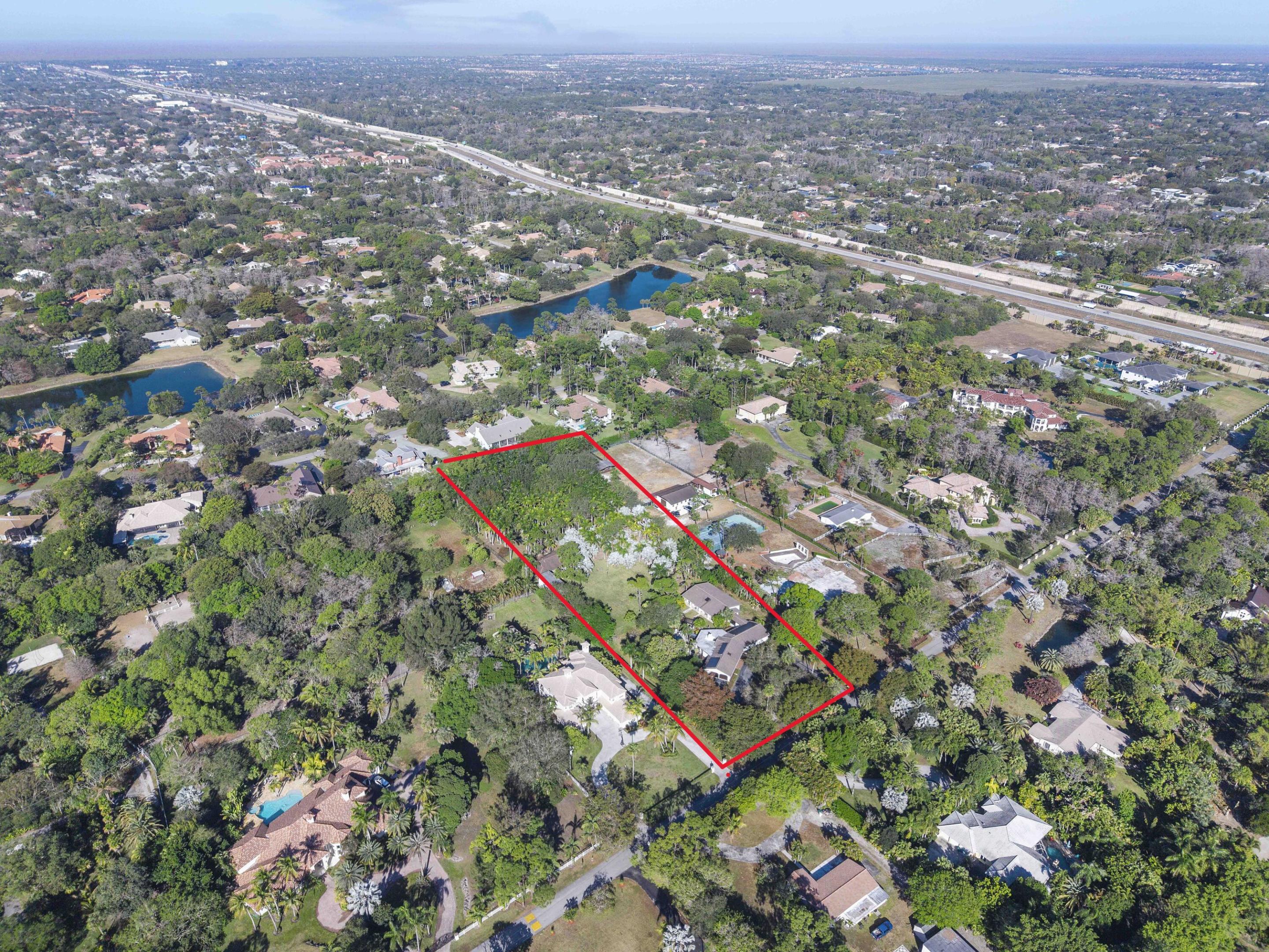 BACK ON MARKET,DEAL FELL THROUGH, 3 Acres in Parkland with 7 bedrooms & 7 bathrooms, open floor plan of living space & many open rooms for all the family's entertainment, Remodeled & designed with 2 identical cottages built & attached with a private gym in 2019, Complete newer electrical & plumbing systems throughout, Hurricane impact windows & doors, Custom walnut kitchen w/center island & granite countertops, Top of the line appliances, Italian designer luxury closets, laminate wood & porcelain flooring, Floating vanities, private soccer field, RV/Boat/Tractor Hanger or can convert into stables, Huge Gazebo area 1200 sq feet of entertaining BBQ & Pizza oven space for parties/meetings/luncheons/training or can convert back into a barn, A+Schools, walk to parks Move-in-ready luxury estate offering privacy, space, and versatility on approximately 3 peaceful acres. This exceptional Parkland property showcases designer-appointed interiors, resort-style pool and entertainment pavilion, outdoor pizza oven, and abundant RV and boat parking. The main residence features 3 bedrooms, 3 bathrooms, office/den, gym, and open living areas ideal for hosting. Two separate guest residences, each with 2 bedrooms and 2 bathrooms, offer ideal accommodations for multi-generational living or guests. A rare opportunity combining country-style living with modern luxury.