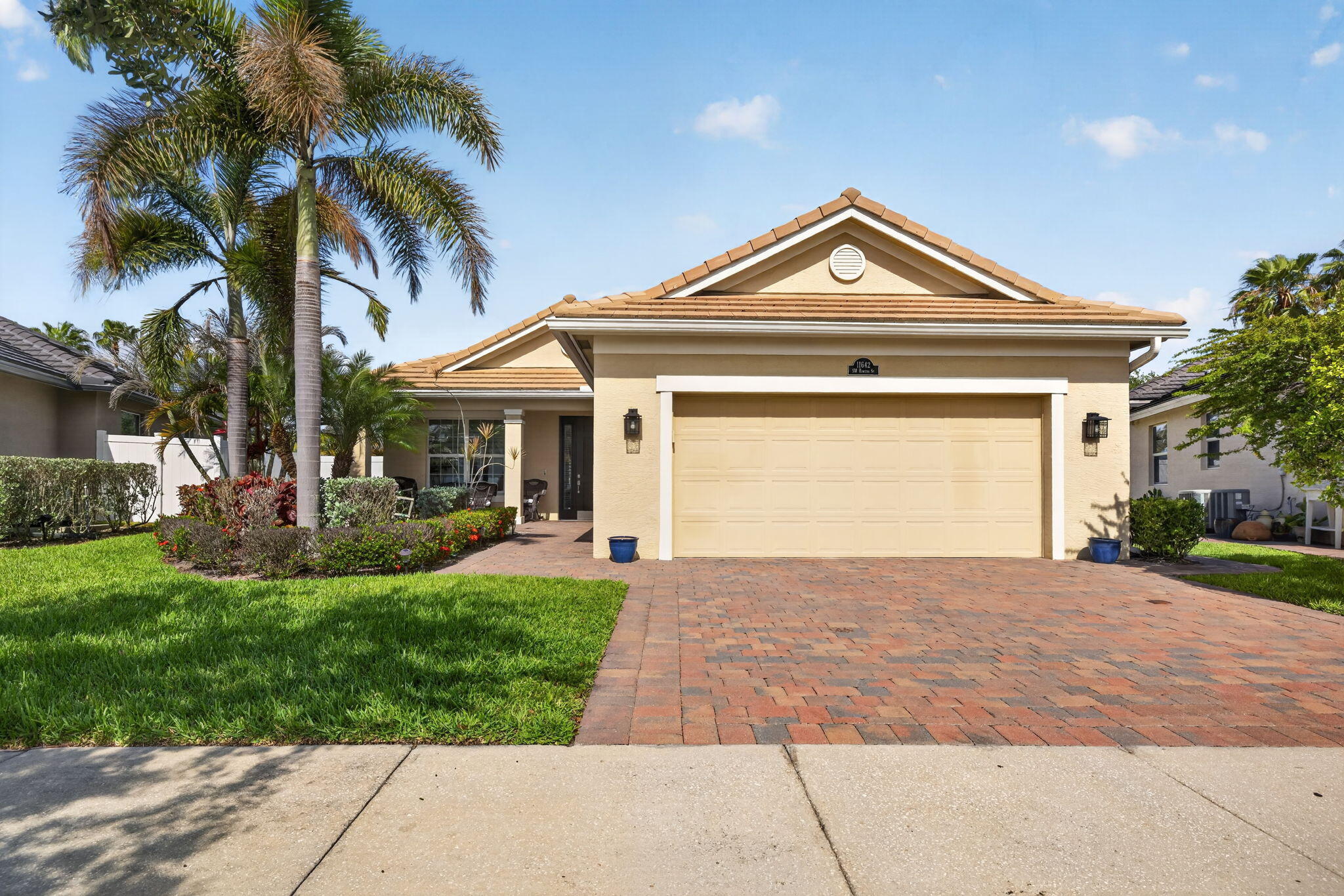 Beautiful GHO Bimini pool home in gated Tradition community, loaded with upgrades. Features include 3 bedrooms, granite kitchen with 2yr old stainless appliances, custom backsplash, crown moldings, diagonal tile, bay window bump-outs, accordion shutters, and a widened driveway with race deck garage floor. Private backyard offers a screened heated pool plus expanded paver patio. Convenient to Tradition Square, Cleveland Clinic, shopping, dining, walking trails, Crosstown, Gatlin and I-95.