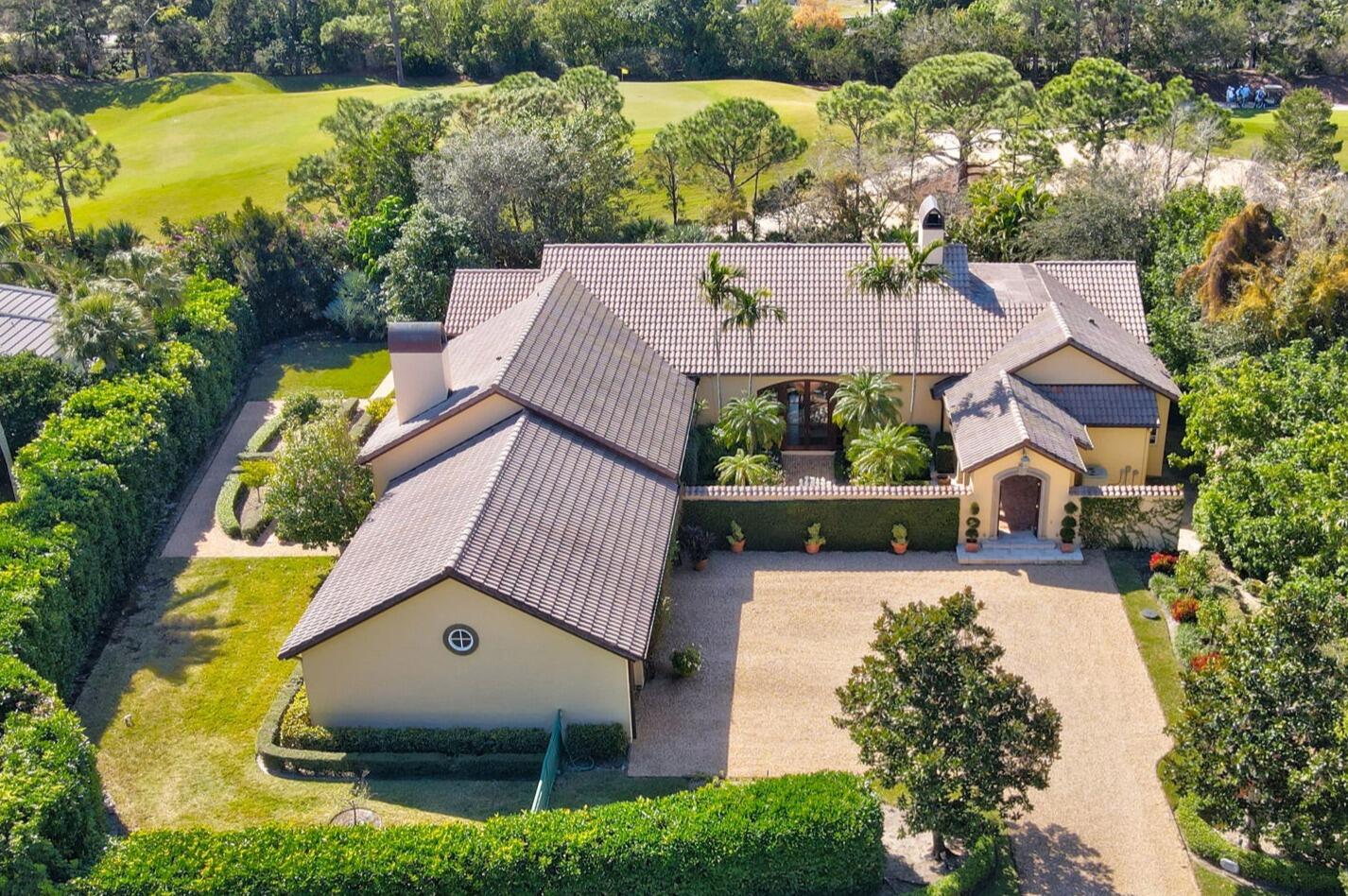 Introducing Tegolaia! Nestled off the third green, this stunning Tuscan-style home blends Old World charm with relaxed luxury. From the moment you arrive, the warm stucco exterior, classic red-tiled roof, and elegantly arched doors transport you to the heart of Italy's countryside. Set on a beautifully landscaped .71-acre lot with vibrant gardens this villa offers unparalleled tranquility and privacy. Inside, the home showcases timeless design elements, including exposed wooden beams, rich hard wood flooring, and mahogany solid core doors throughout. The spacious living room features a dramatic fireplace, perfect for cozy gatherings. The gourmet kitchen is a chef's dream, equipped with top-of-the-line stainless steel appliances, a center island, and custom cabinetry that exudes rustic elegance. An expansive master suite provides a peaceful retreat with it's coved ceiling, attached study, and luxurious en-suite his and her bathrooms, complete with a soaking tub, walk-in shower, and separate closets.

The guest wing of this home blends charm with comfort. Guests are welcomed to their own private entrance to the Loggia and pool, as well as an equipped mini kitchen allowing for convenience and independence. The well-appointed bedrooms and en-suite bathrooms provide a tranquil retreat, one with a deep soaking tub, and the other a walk-in shower. Whether for short stays or longer visits, this private sanctuary ensures guests feel both pampered and at home.

Outdoors, the private courtyards beckons with tranquil ambiance, an ideal space for al fresco dining or enjoying a glass of wine while taking in the garden views. Off the living room, French doors open to the expansive covered loggia inviting you to the sparkling pool and is the perfect place to unwind. This Tuscan-inspired home is a true masterpiece that offers a perfect blend of style, comfort, and elegance. Experience the beauty of Italy, right from your own doorstep. Don't miss your chance to own this exceptional property.