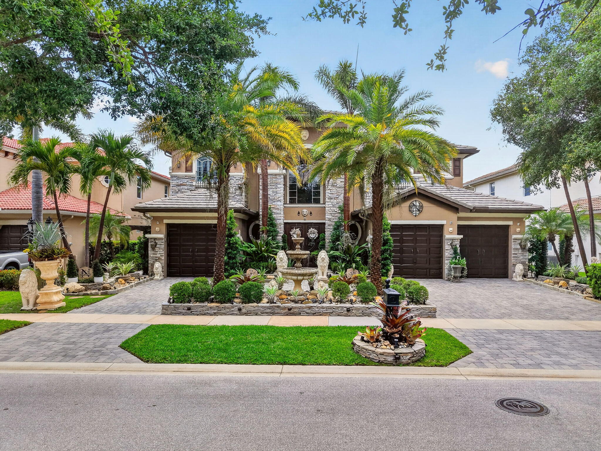 Experience luxury living at its finest in this exquisite Ternbridge model by renowned builder Toll Brothers, perfectly positioned on a premium lakefront lot w/expansive water views & unforgettable sunset. This beautifully appointed residence offers the ideal blend of elegance, comfort, and resort style outdoor living.  5 Grand Bedrooms | 5 Full Bathrooms, 3 Car Garage & Governors Driveway, Impact Glass & Accordion Shutters, New A/C Units, Tinted Windows, Plantation Shutters & Crown Molding Throughout. Step through the impressive grand foyer & be greeted by a dramatic curved staircase & soaring ceilings. The home features a formal living room, formal dining room, spacious family room, an upstairs loft—perfect for additional living or entertainment space. Gourmet Kitchen and so much more! The gourmet kitchen is a chef's dream, complete with granite countertops, newer stainless appliances, ample cabinetry, and a functional layout ideal for cooking and hosting. Wrought iron railings, elegant architectural details, and abundant natural light enhance the home's timeless appeal.  Your private tropical retreat awaits. Enjoy an oversized screened lanai, perfect for gatherings, parties, or quiet relaxation. The resort style heated saltwater pool and spa overlook wide lake views, creating a serene backdrop for year round enjoyment. Lush landscaping surrounds the property, offering beauty and privacy.  Located in the desirable man gated community of Wellington View, residents enjoy: Low HOA fees, Beautifully maintained grounds, Proximity to top tier amenities, Just minutes from the Wellington Equestrian Center, world class shopping, dining, parks, beaches, & everything Palm Beach has to offer, this home delivers both luxury and convenience. You'll love calling 611 Edgebrook Lane home—where every day feels like a vacation.