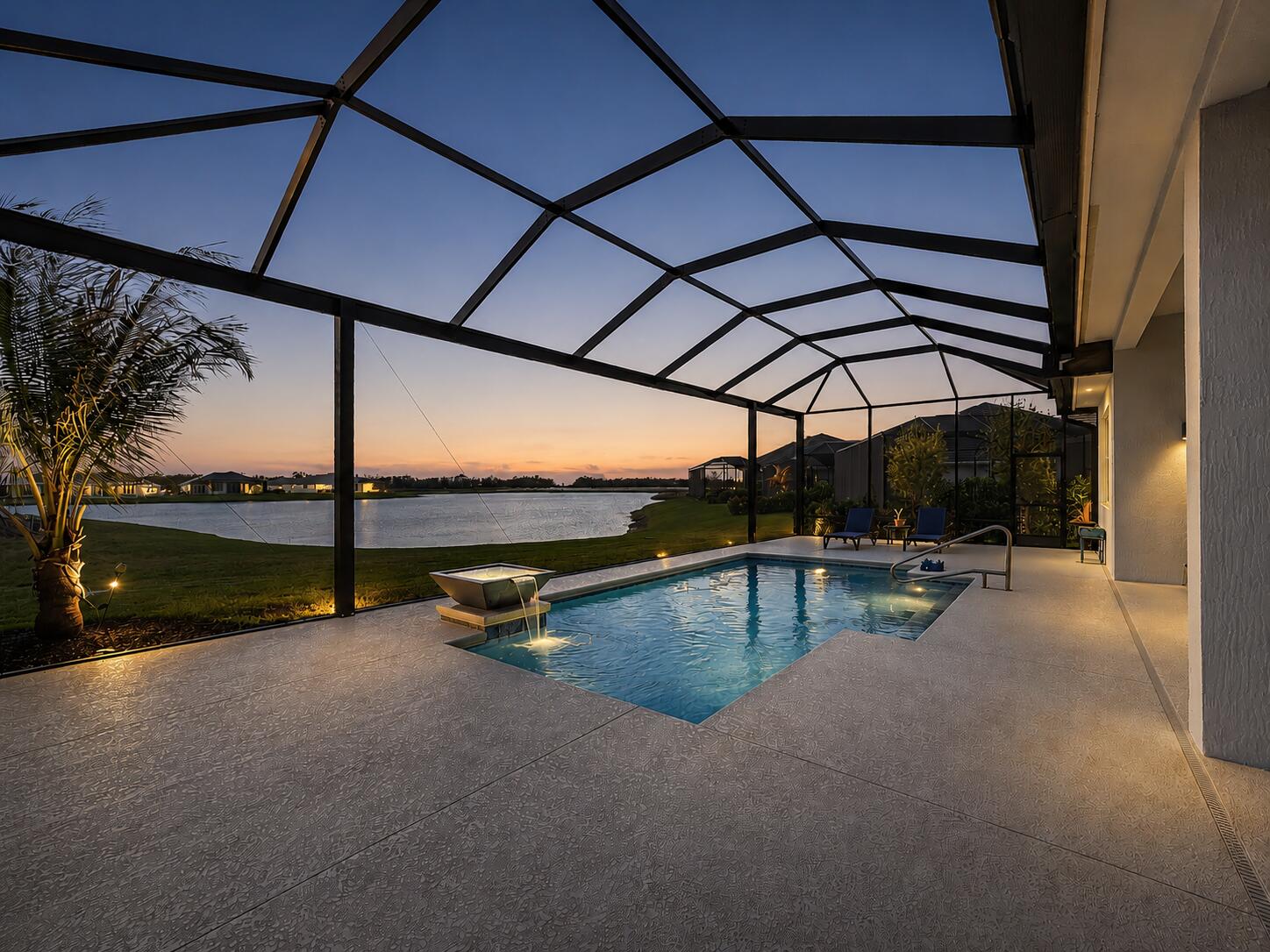 Imagine every evening with stunning sunset poolside lakeviews...Designed by a high-end local builder with exceptional attention to detail, this 4-bed + office, 3.5-bath home features elegant coffered ceilings and a grand glass double-door entry. The oversized gourmet kitchen showcases navy cabinetry, quartz countertops, and opens seamlessly to the great room with a stylish wet bar + a convenient cabana bath for pool access - perfect for entertaining. This new construction home includes hurricane impact windows, spray foam insulation for energy efficiency, tile flooring throughout, and an epoxy floor garage with EV charger. In a private boutique gated community ideally located in Tradition near endless shopping & dining and ~30 minutes from Jupiter & Palm Beach Gardens.